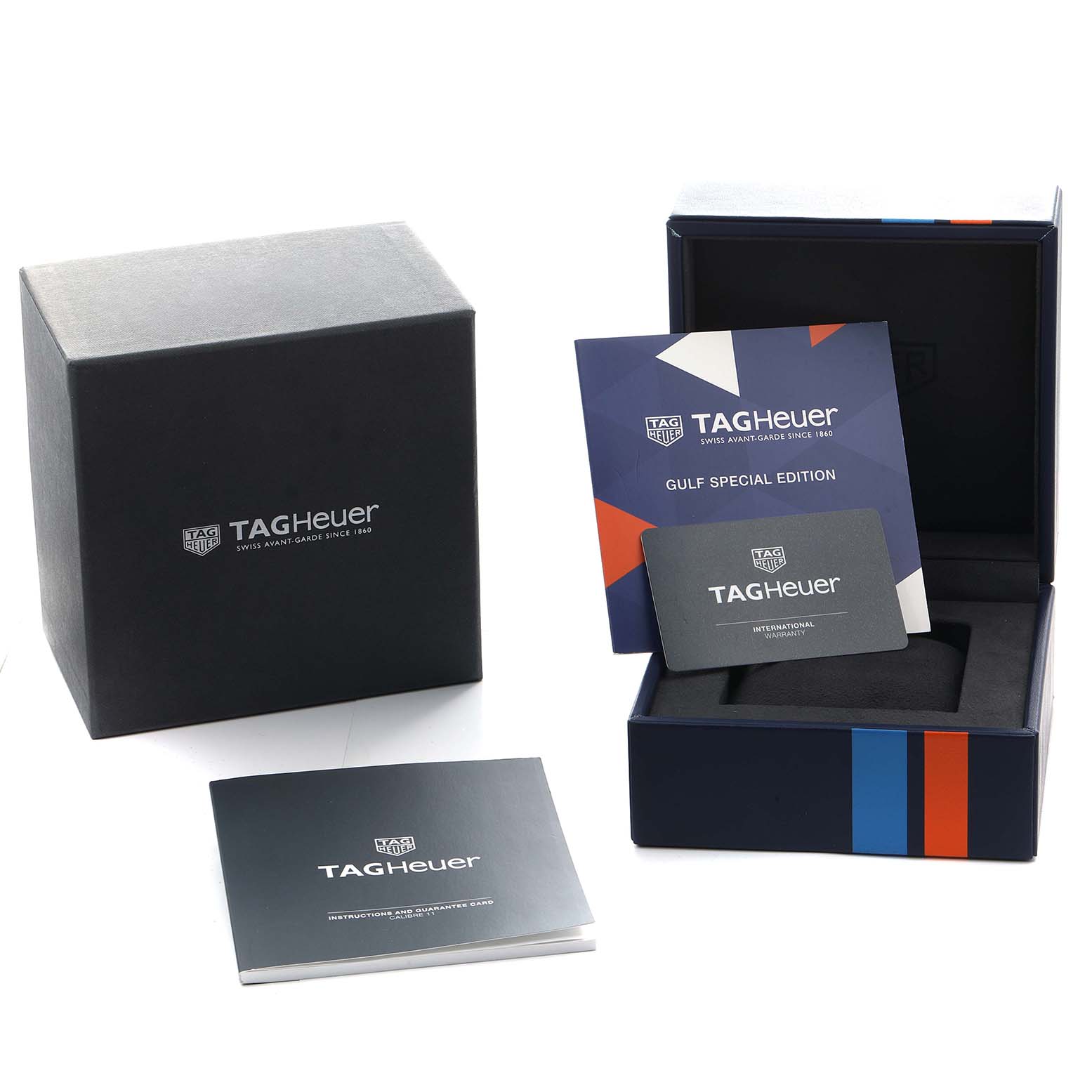 The image shows the packaging and accessories for a Tag Heuer Monaco CAW211R Men
s Stainless Steel Blue Dial watch, including a box, warranty card, and booklet.