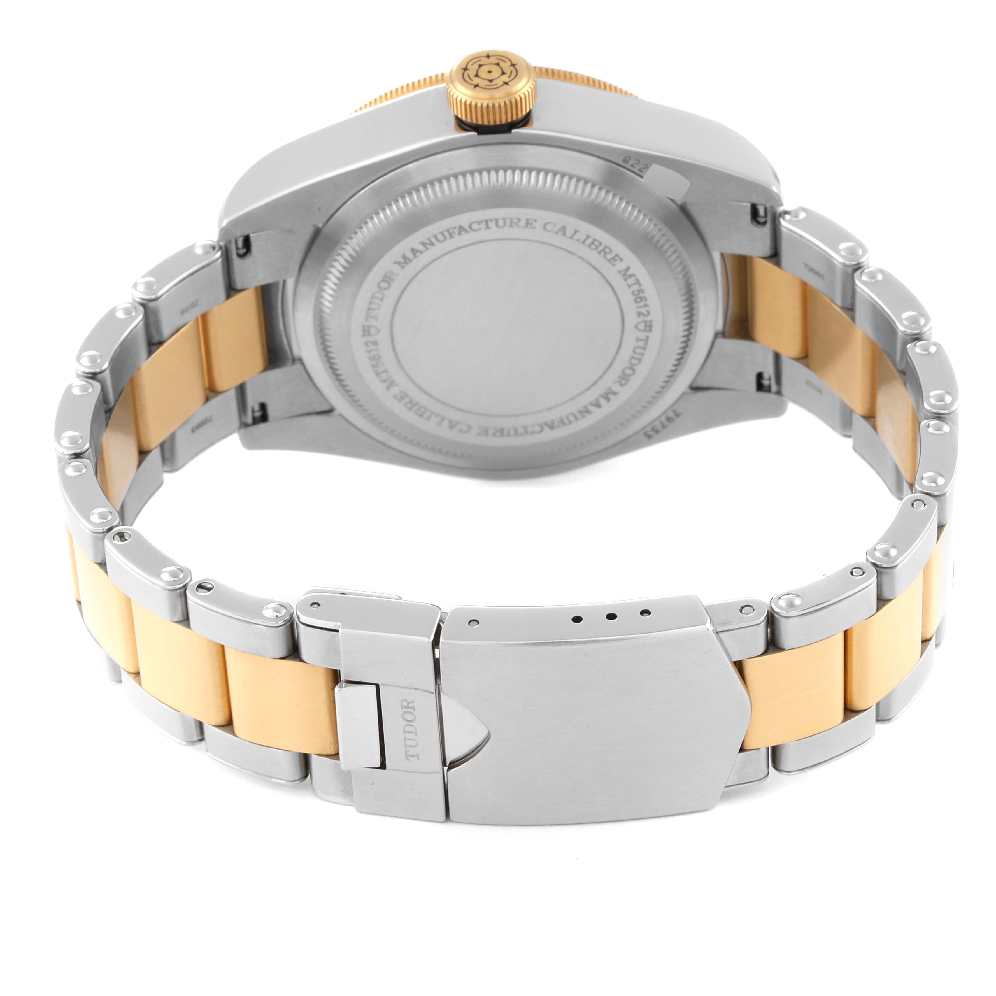 This image shows the backside and clasp of a Tudor Heritage Black Bay 79733 Men's Steel and Gold (two tone) Champagne Dial 79733 Men's Steel and Gold (two tone) Champagne Dial watch, highlighting its stainless steel and gold bracelet.