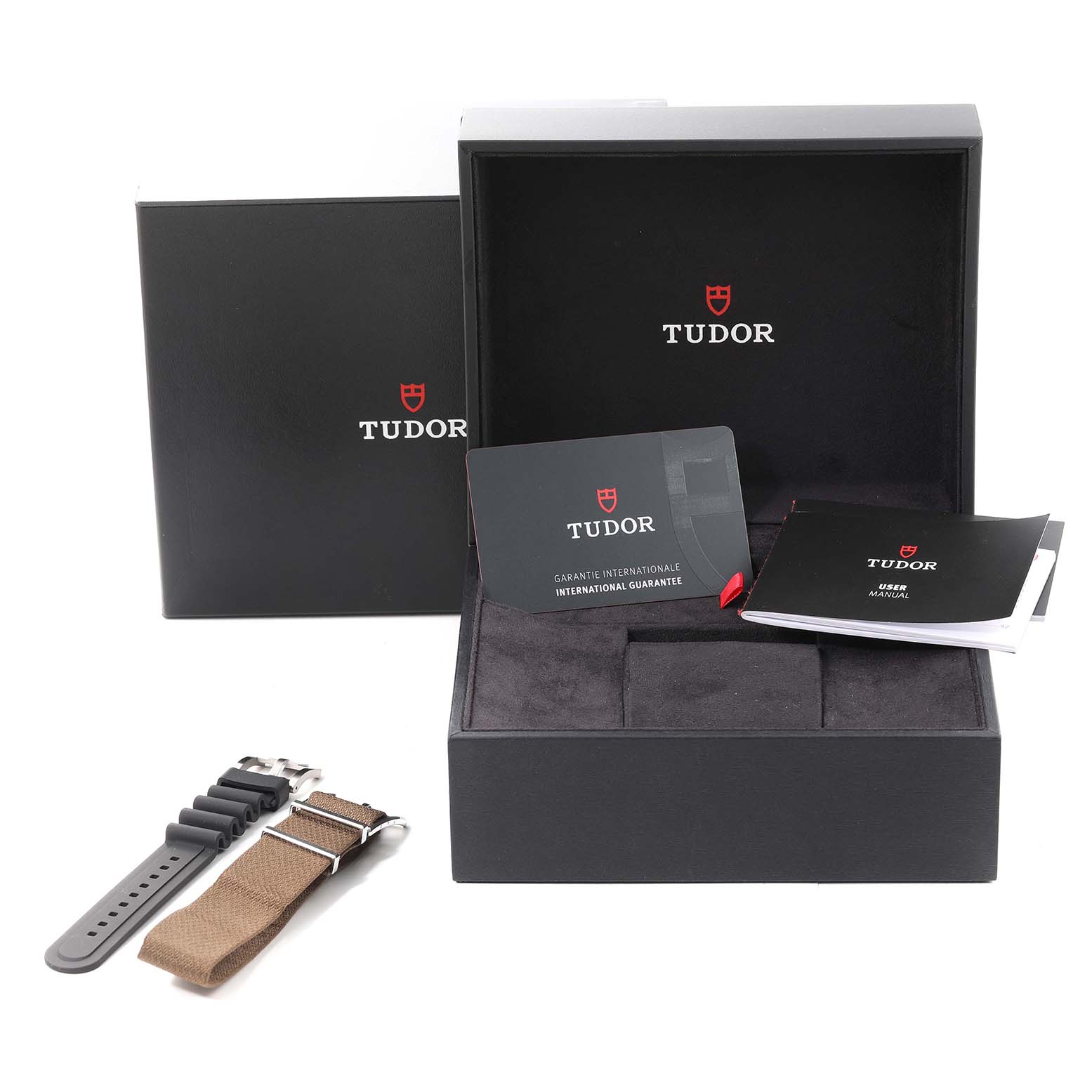 The image shows the packaging, manuals, and additional straps for the Tudor Heritage Black Bay 79733 Men's Steel and Gold (two tone) Champagne Dial 79733 Men's Steel and Gold (two tone) Champagne Dial model watch.