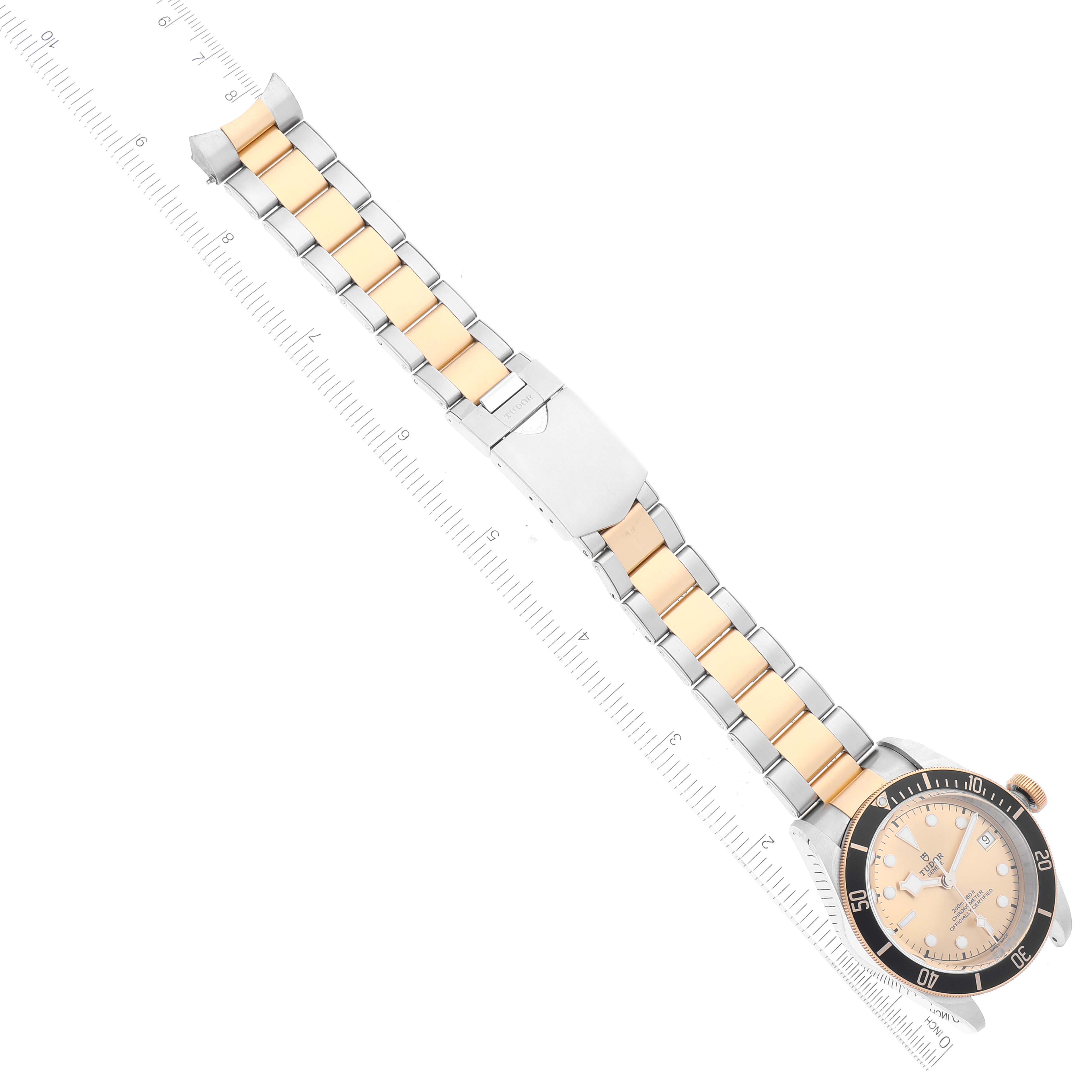 This image shows a top view of a Tudor Heritage Black Bay 79733 Men's Steel and Gold (two tone) Champagne Dial 79733 Men's Steel and Gold (two tone) Champagne Dial watch, displaying the bracelet and part of the watch face.