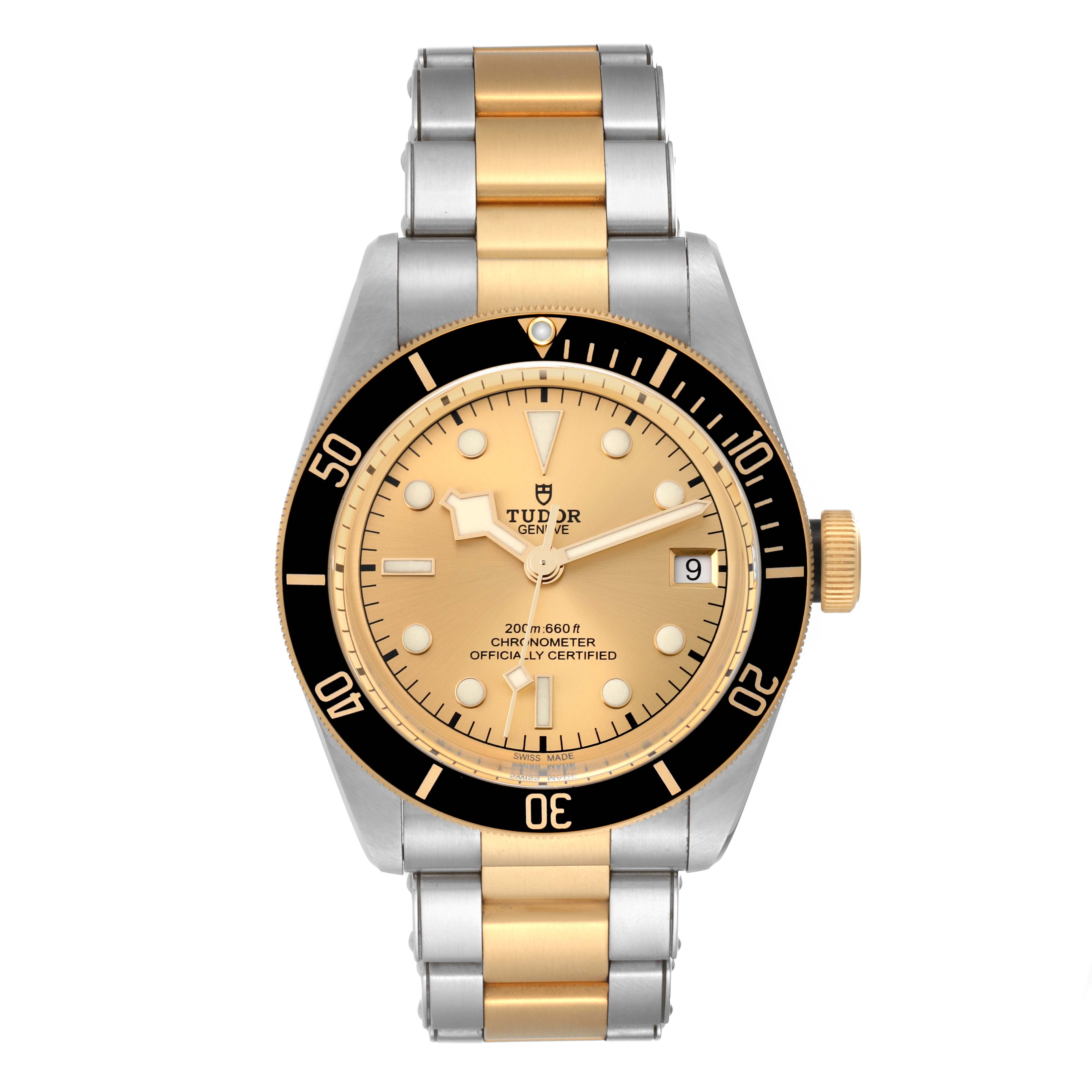 The image shows a front view of a Tudor Heritage Black Bay 79733 Men's Steel and Gold (two tone) Champagne Dial 79733 Men's Steel and Gold (two tone) Champagne Dial watch, highlighting its gold dial, black bezel, and two-tone bracelet.