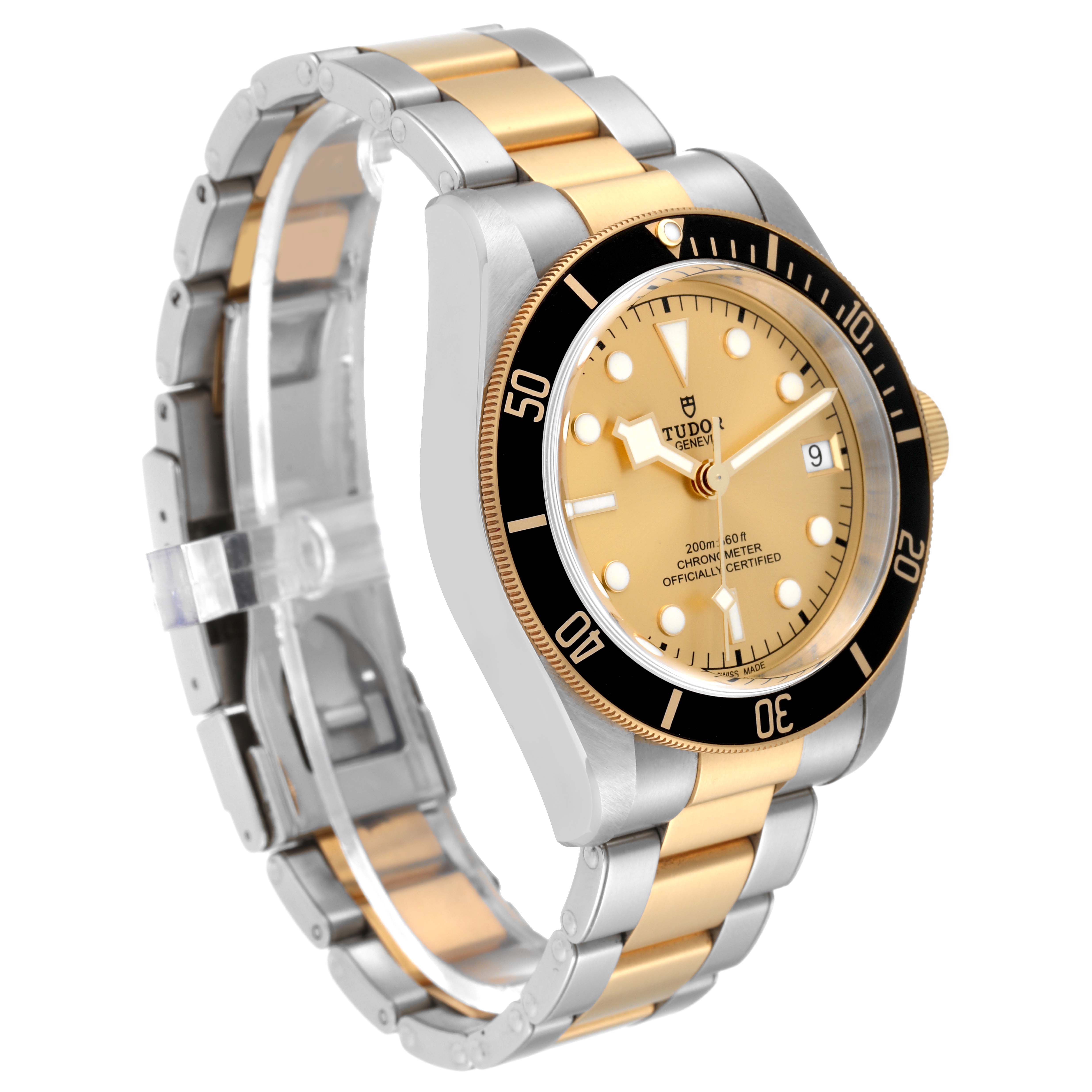 The image shows a Tudor Heritage Black Bay 79733 Men's Steel and Gold (two tone) Champagne Dial 79733 Men's Steel and Gold (two tone) Champagne Dial watch at a three-quarter angle, highlighting its gold and steel case, bezel, and bracelet.