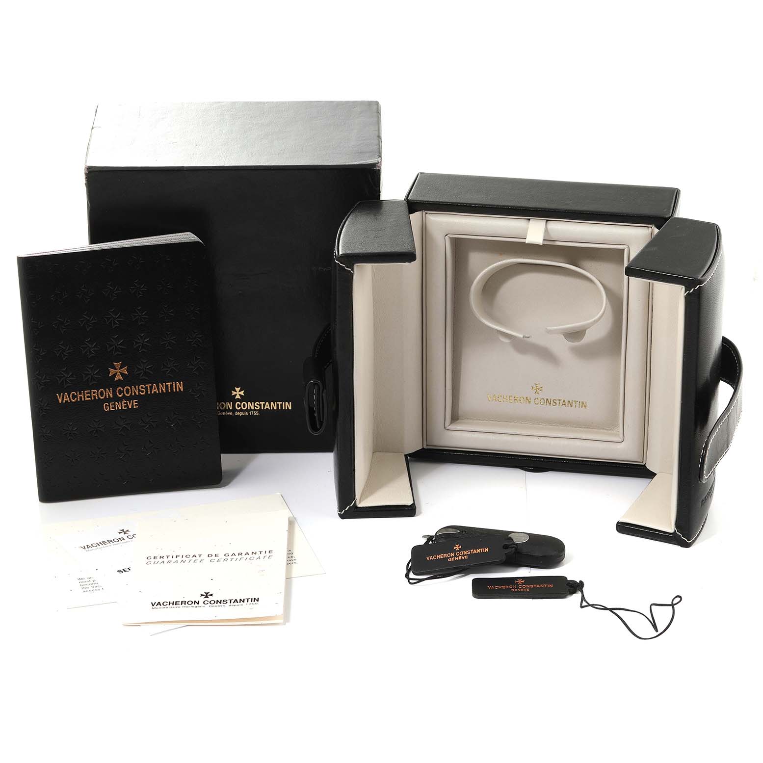 The image shows a Vacheron Constantin Overseas 47560/D01R-9672 Women's Rose Gold Silver Dial 47560/D01R-9672 Women's Rose Gold Silver Dial watch box set from a front angle, including the watch case, literature, and tags.