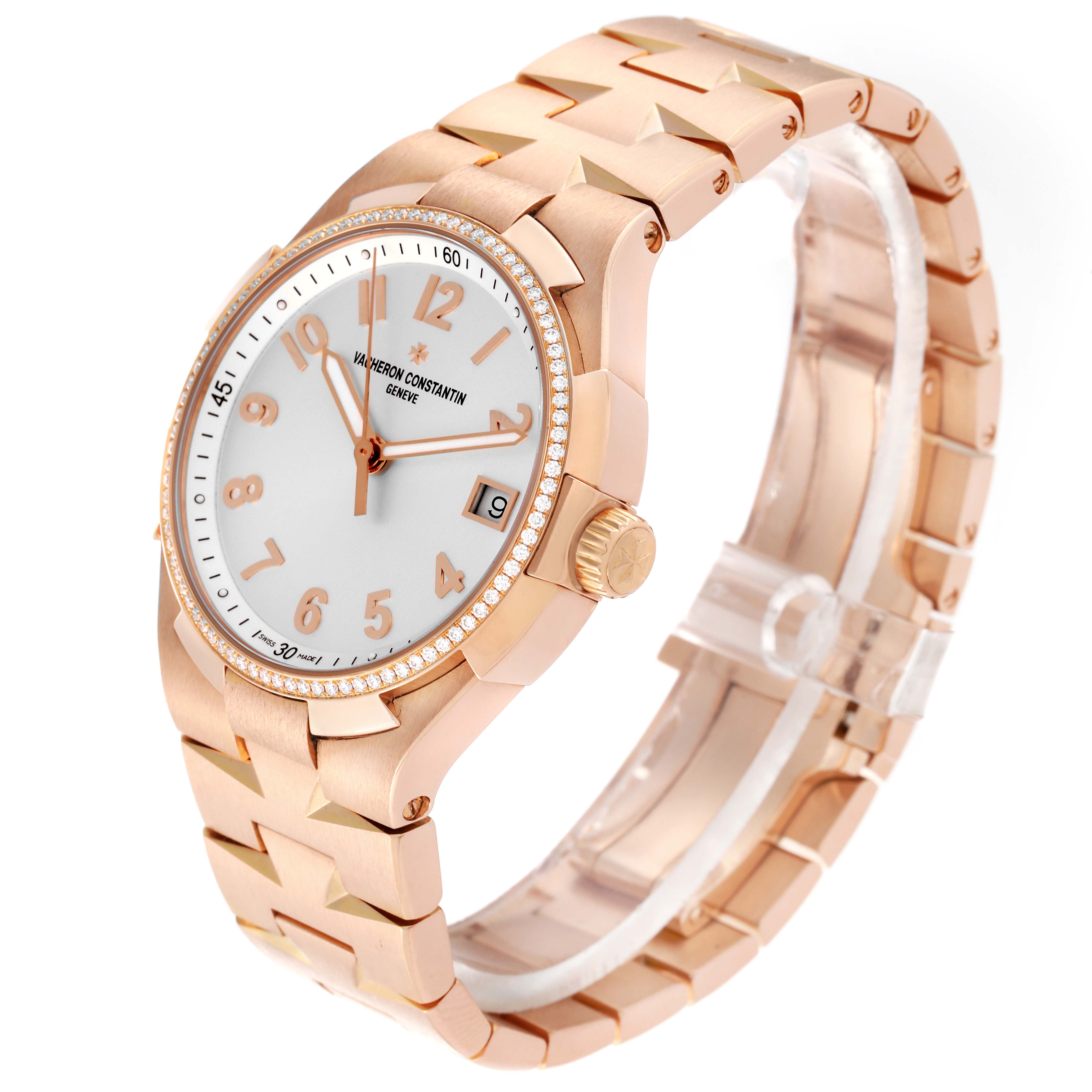 The image shows a Vacheron Constantin Overseas 47560/D01R-9672 Women's Rose Gold Silver Dial 47560/D01R-9672 Women's Rose Gold Silver Dial watch at an angled side view highlighting the bezel, dial, and bracelet.