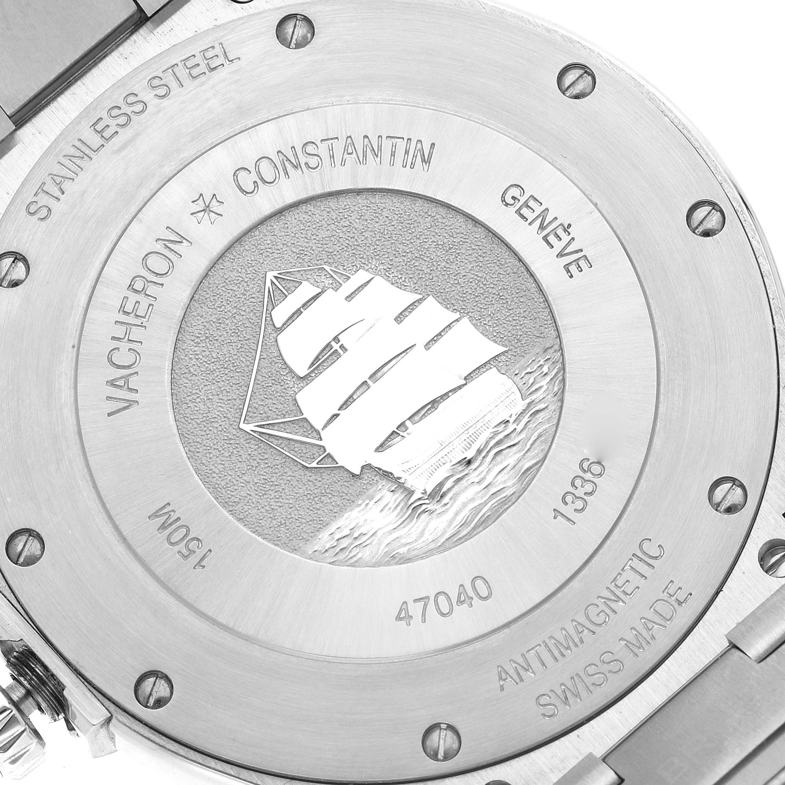 This is a close-up of the back case of the Vacheron Constantin Overseas 47040B01A-9093 Men
s Stainless Steel Silver Dial 47040B01A-9093 Men
s Stainless Steel Silver Dial watch, showing the engraved sailboat and inscriptions.