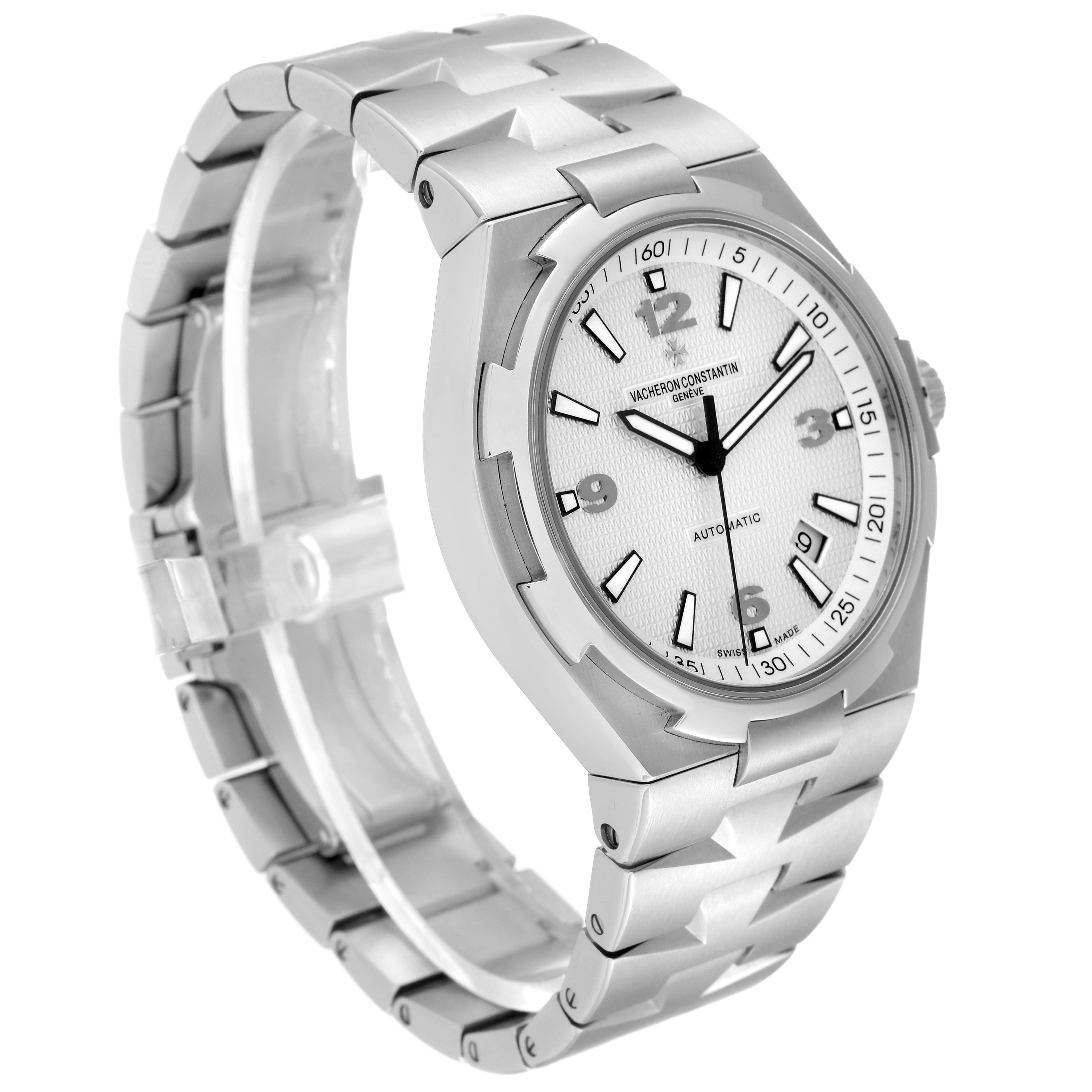 The image shows a Vacheron Constantin Overseas 47040B01A-9093 Men
s Stainless Steel Silver Dial 47040B01A-9093 Men
s Stainless Steel Silver Dial watch from a three-quarter angle, displaying its face, dial, and stainless steel bracelet.