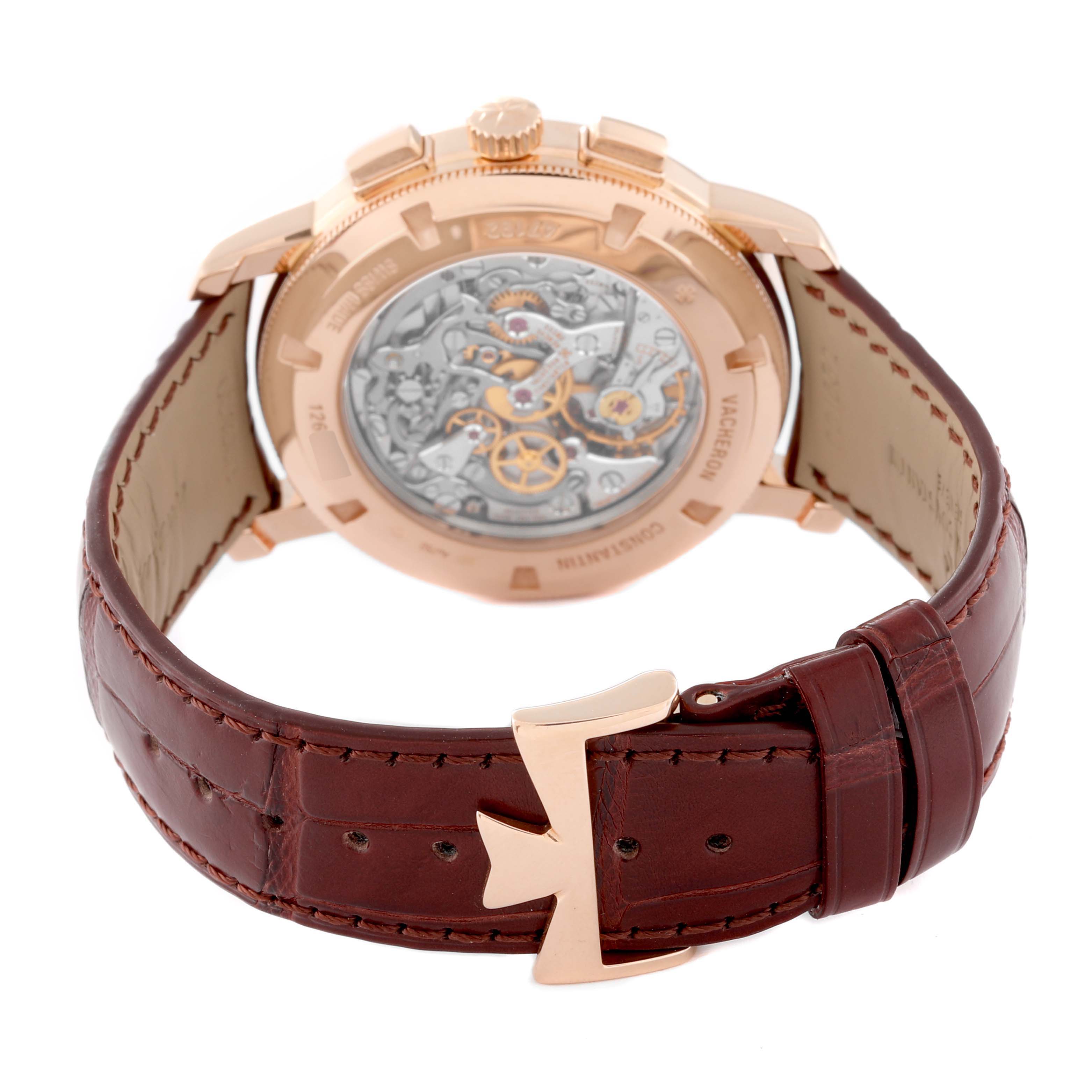 The image shows the back view of the Traditionnelle model by Vacheron Constantin, displaying its intricate mechanical movement and leather strap.