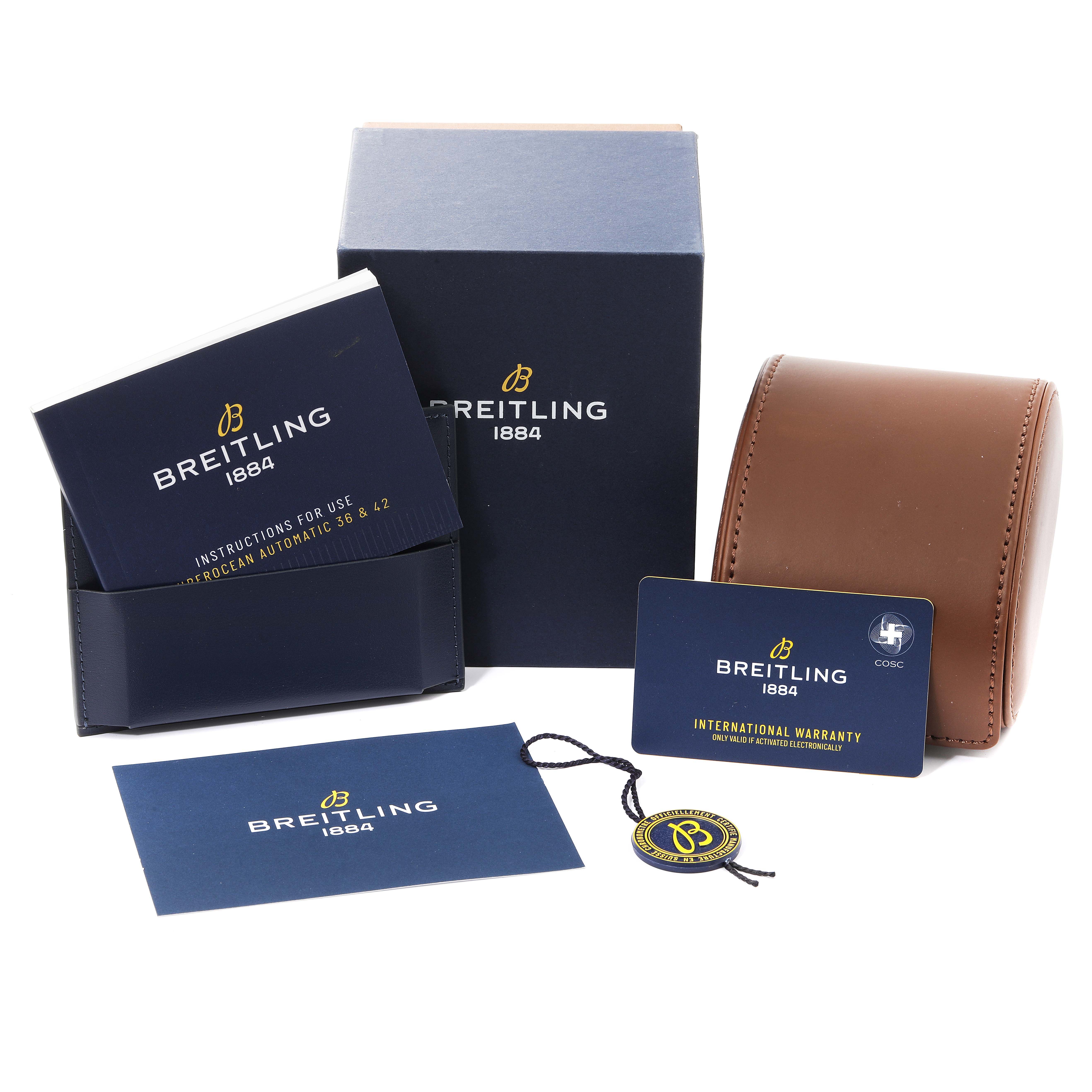 The image shows packaging and documents for the Breitling Superocean A17366 Men
s Stainless Steel White Dial A17366 Men
s Stainless Steel White Dial watch, including instructions, warranty card, box, and hang tag.