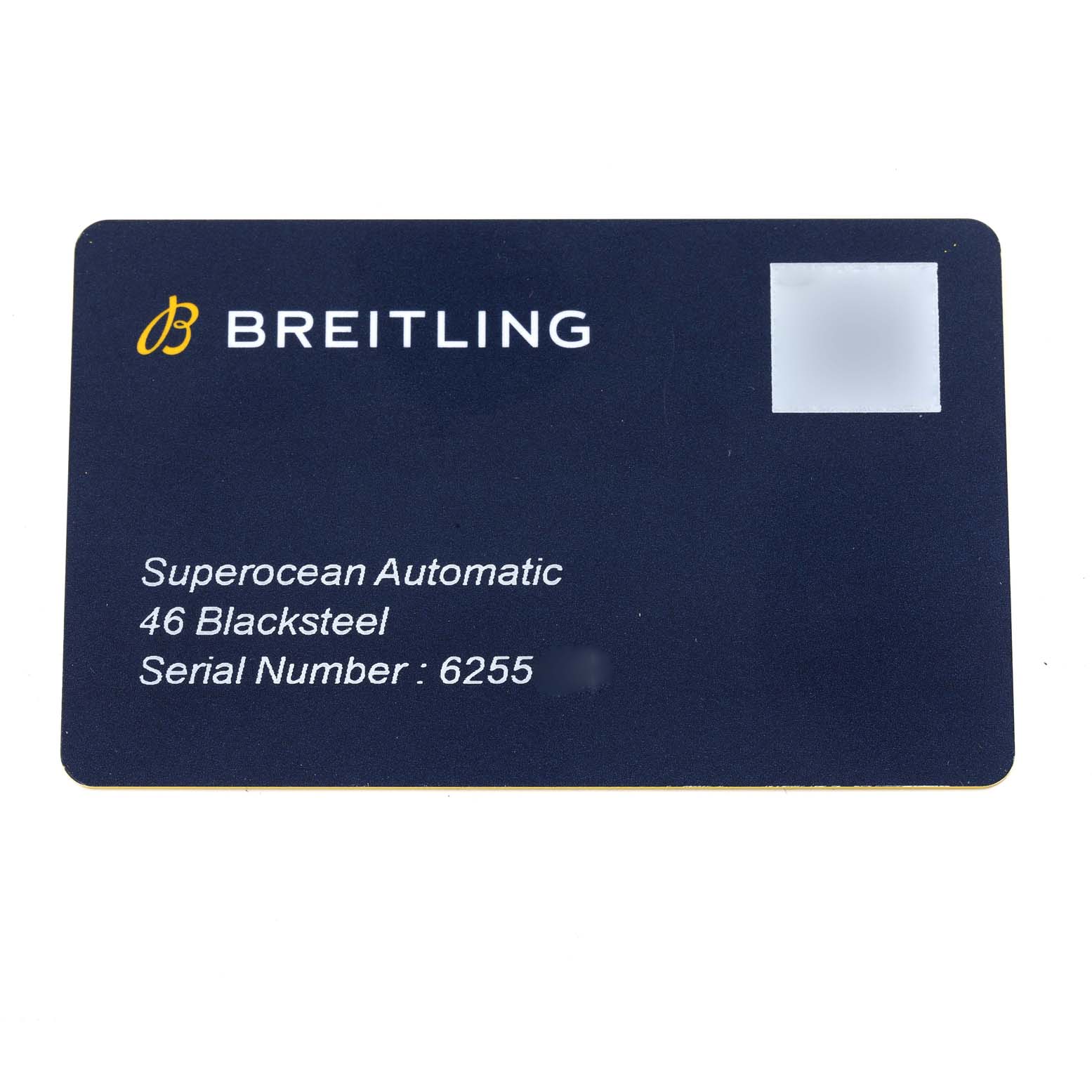This image shows a Breitling Superocean M17368 Men's Stainless Steel Black Dial M17368 Men's Stainless Steel Black Dial Automatic model warranty card displaying the watch model, material, and serial number.