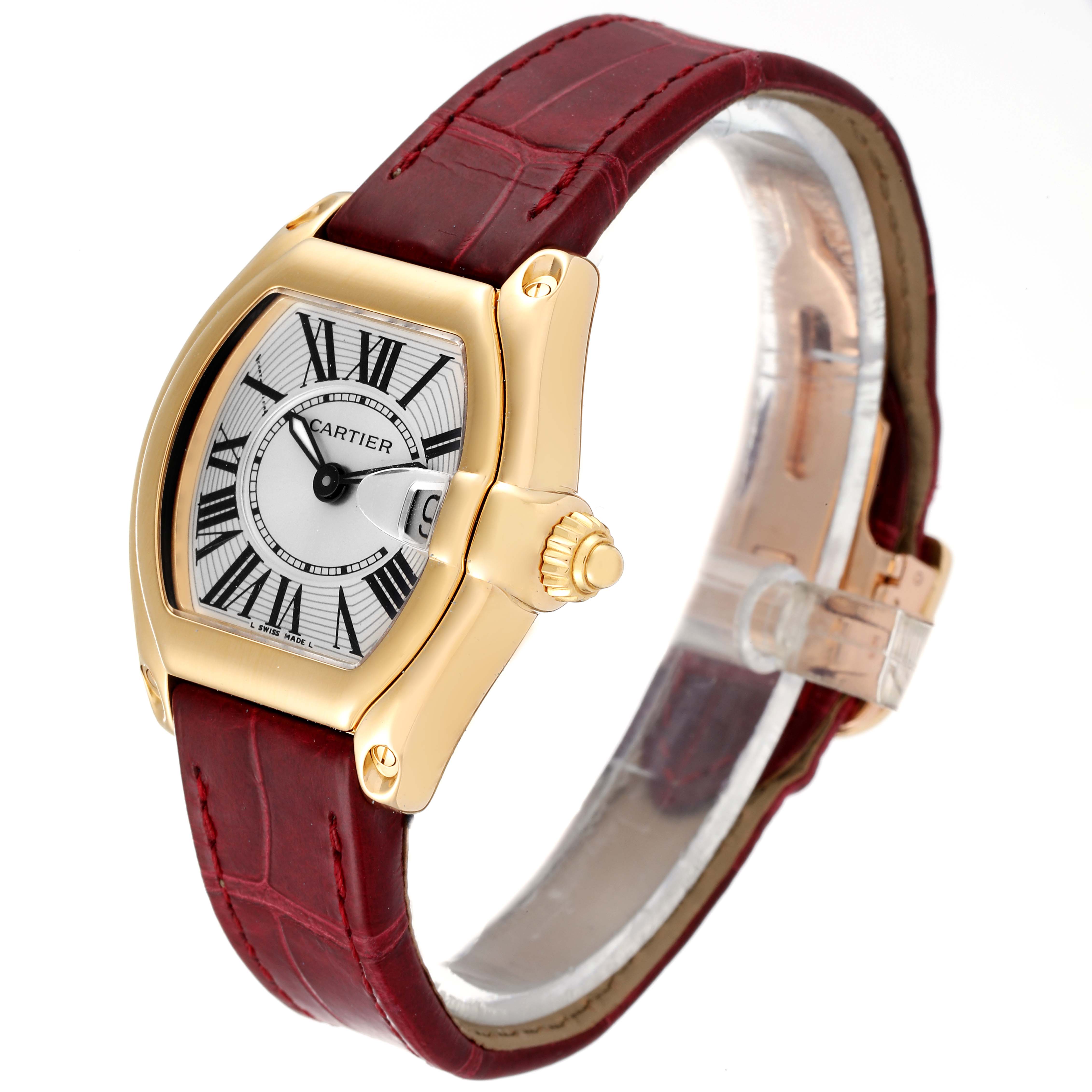 This is a Cartier Roadster W62018Y5 Women's Yellow Gold Silver Dial W62018Y5 Women's Yellow Gold Silver Dial watch shown at a front-left angle, displaying its dial, gold casing, crown, and red leather strap.