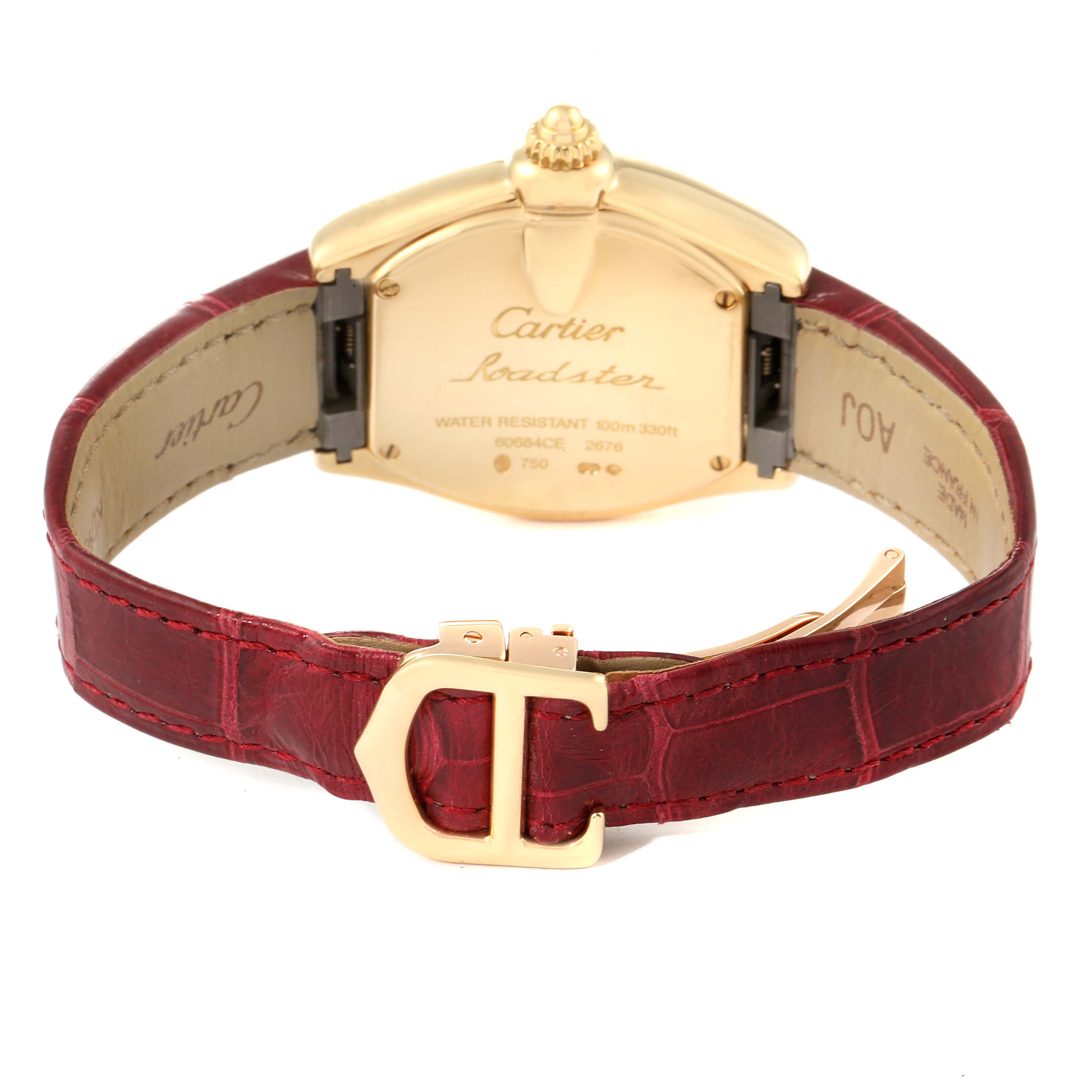 The image shows the back view of a Cartier Roadster W62018Y5 Women's Yellow Gold Silver Dial W62018Y5 Women's Yellow Gold Silver Dial watch with a red leather strap and a gold-toned buckle.