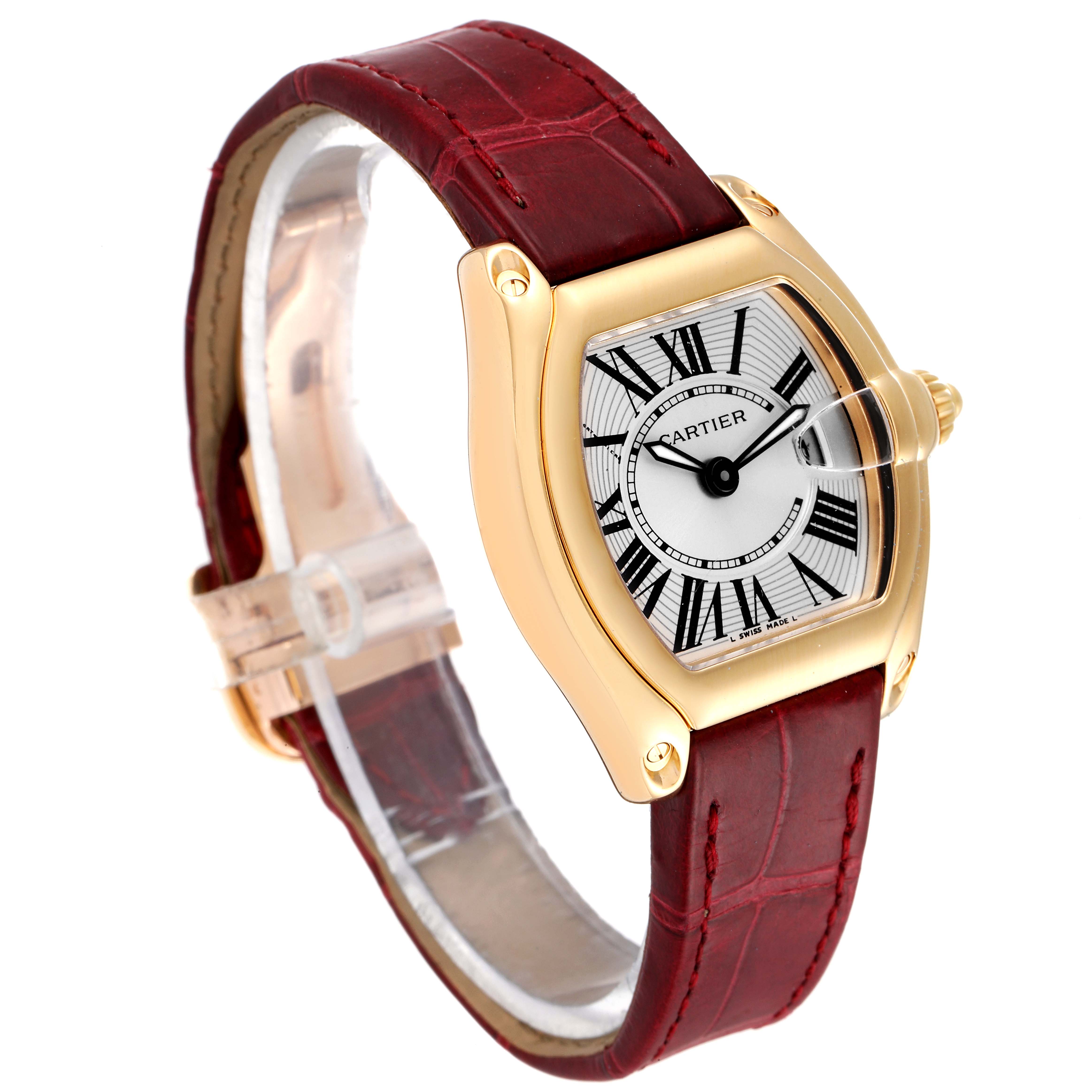 The Cartier Roadster W62018Y5 Women's Yellow Gold Silver Dial W62018Y5 Women's Yellow Gold Silver Dial watch is shown at a slight angle, displaying the face, case, crown, and red leather strap.