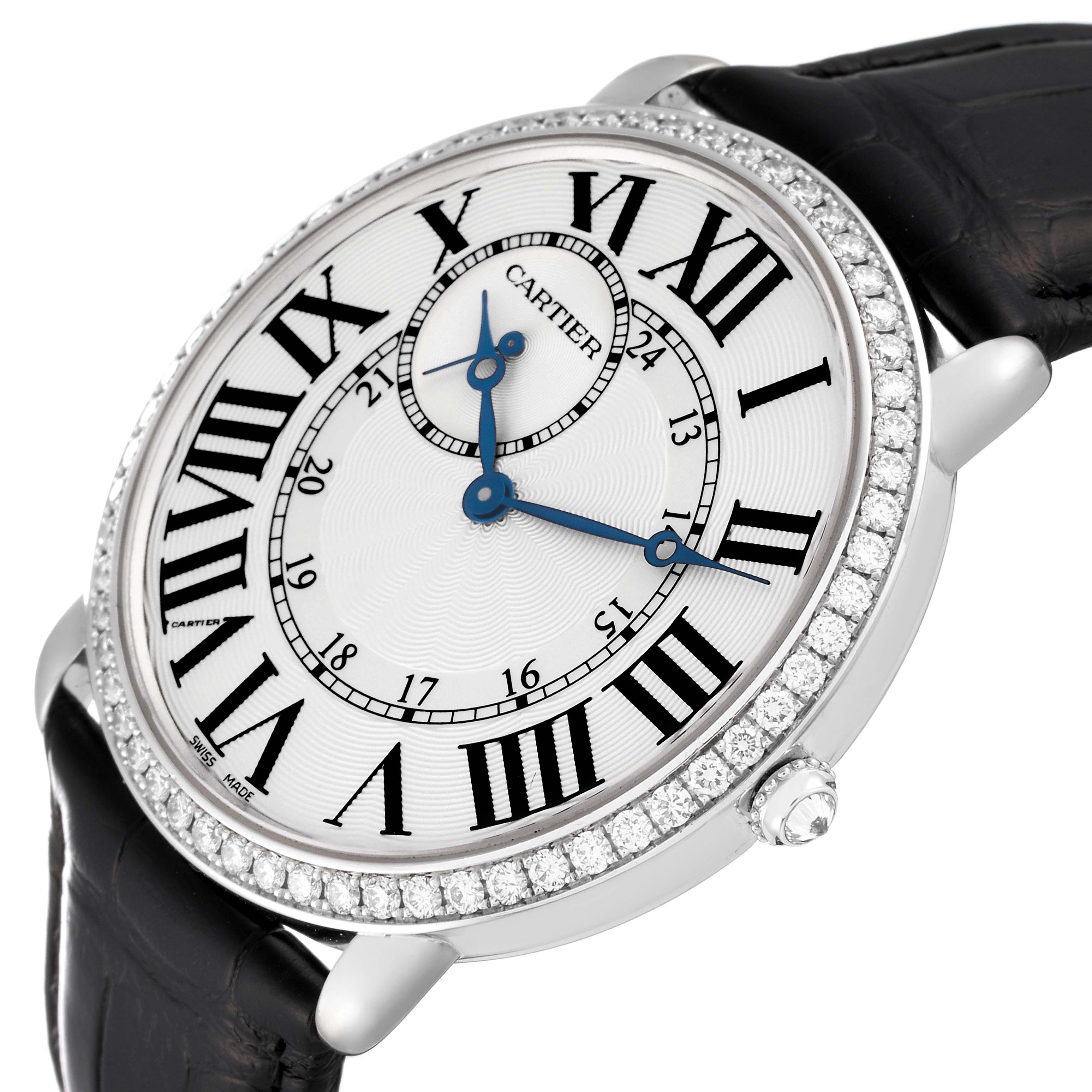 The Cartier Ronde WR007002 Men's White Gold Silver Dial WR007002 Men's White Gold Silver Dial watch is shown at an angled view, displaying the face, bezel, and part of the leather strap.