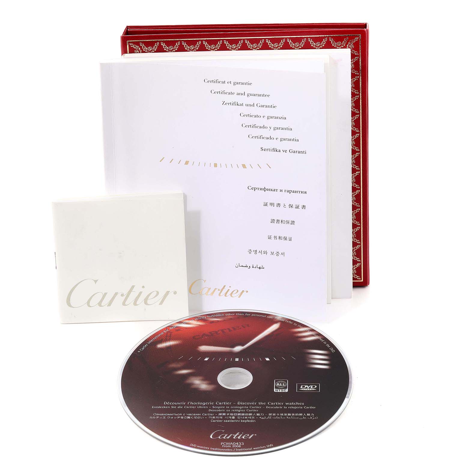 The image shows the warranty booklets, a DVD, and a red box for the Cartier Santos W200728G Men's Stainless Steel Silver Dial W200728G Men's Stainless Steel Silver Dial watch model.
