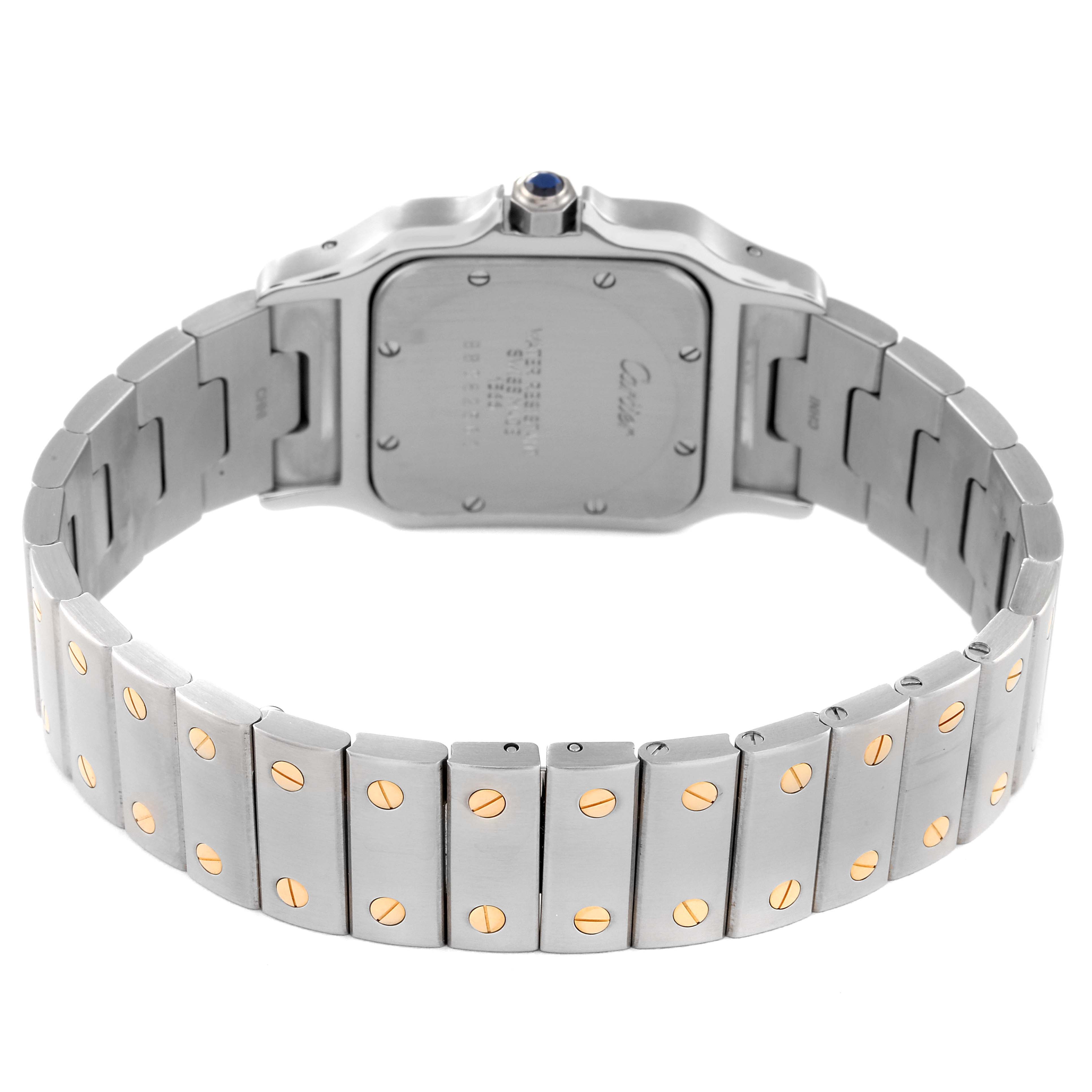 The image shows the back view of a Cartier Santos W20011C4 Men
s Steel and Gold (two tone) Silver Dial W20011C4 Men
s Steel and Gold (two tone) Silver Dial watch, highlighting its case back and metal bracelet with gold screws.