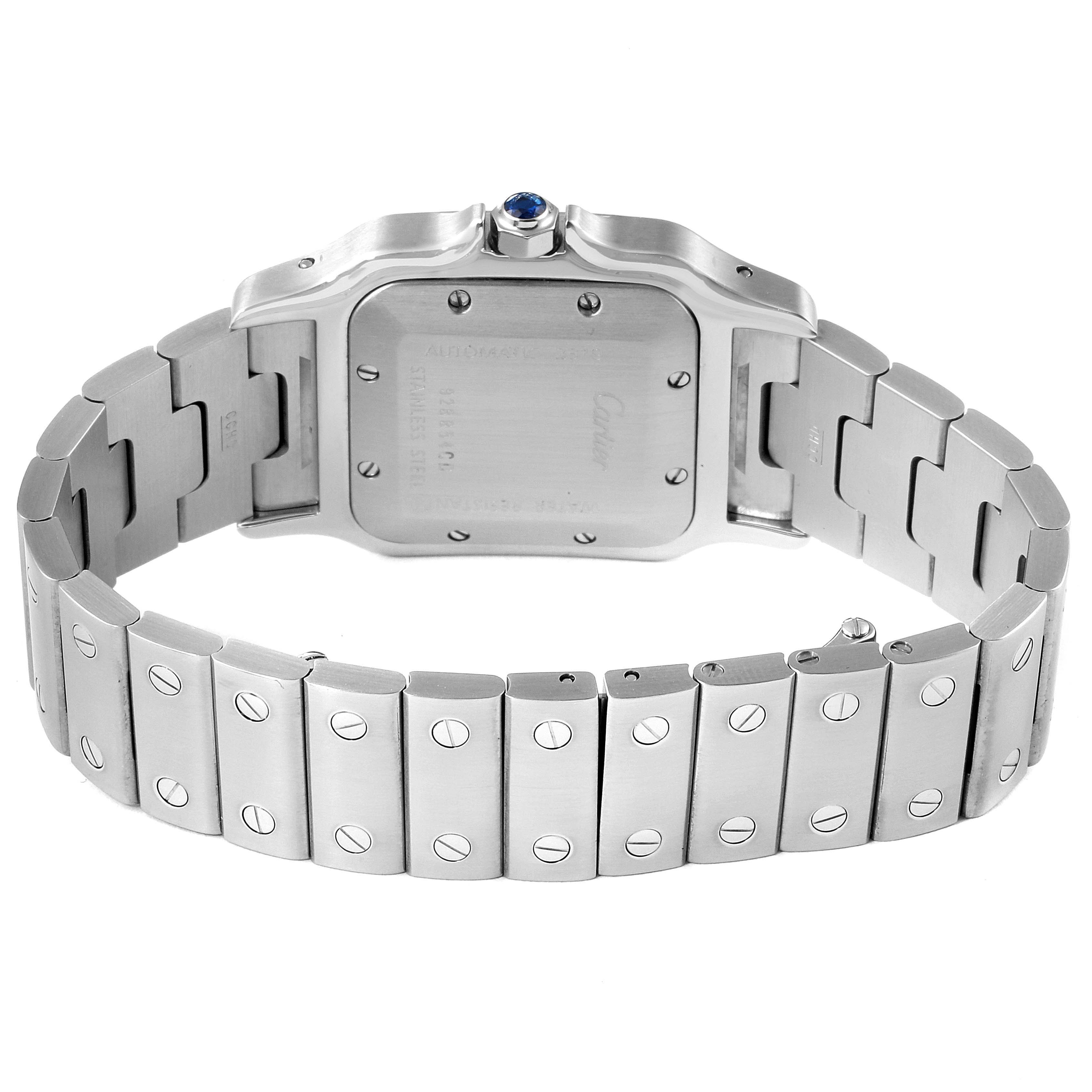 This image shows the back view of a Santos model by Cartier, highlighting its stainless steel case and bracelet.