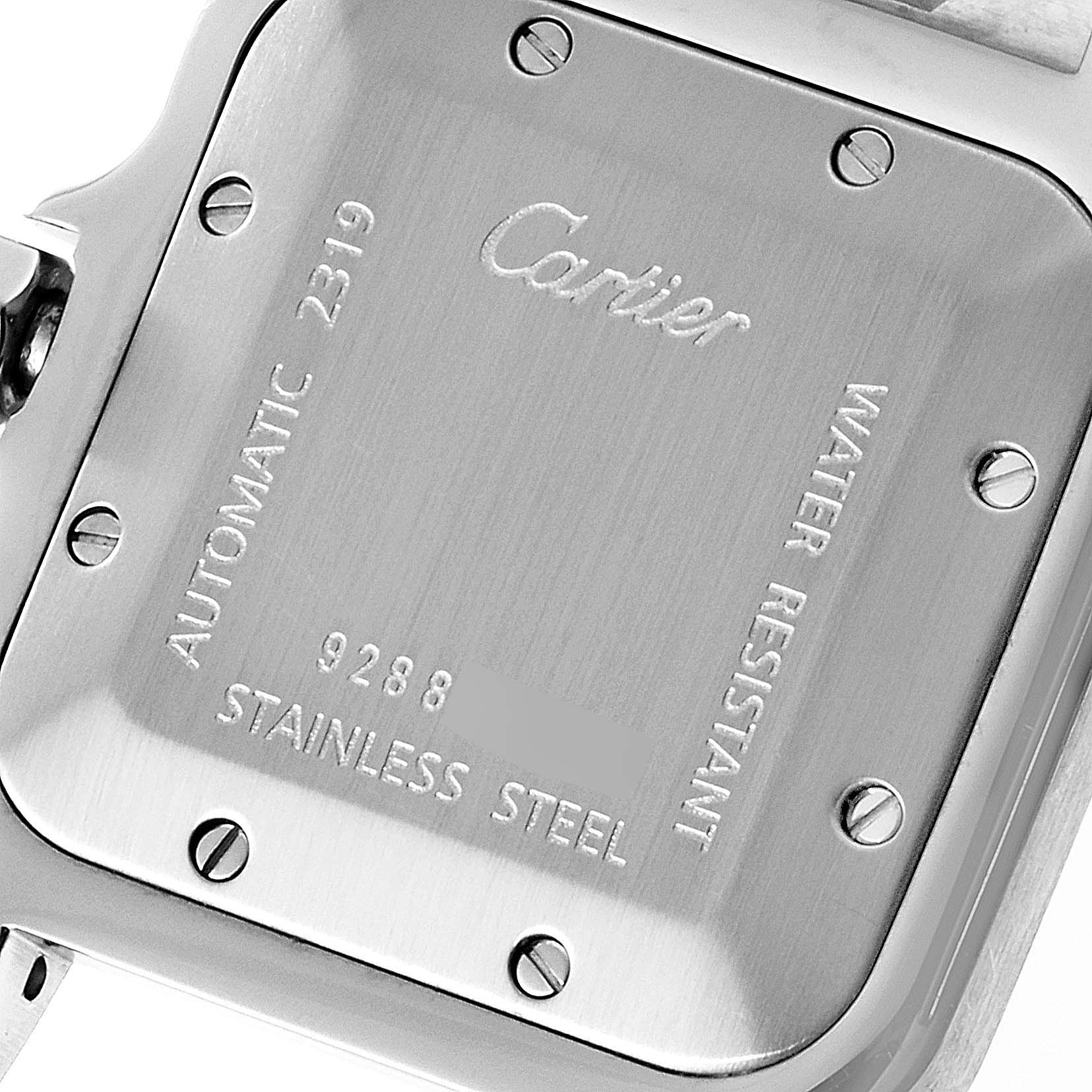 This image shows the back case of a Cartier Santos W20055D6 Men
s Stainless Steel Silver Dial W20055D6 Men
s Stainless Steel Silver Dial model watch, displaying its engravings and screws.