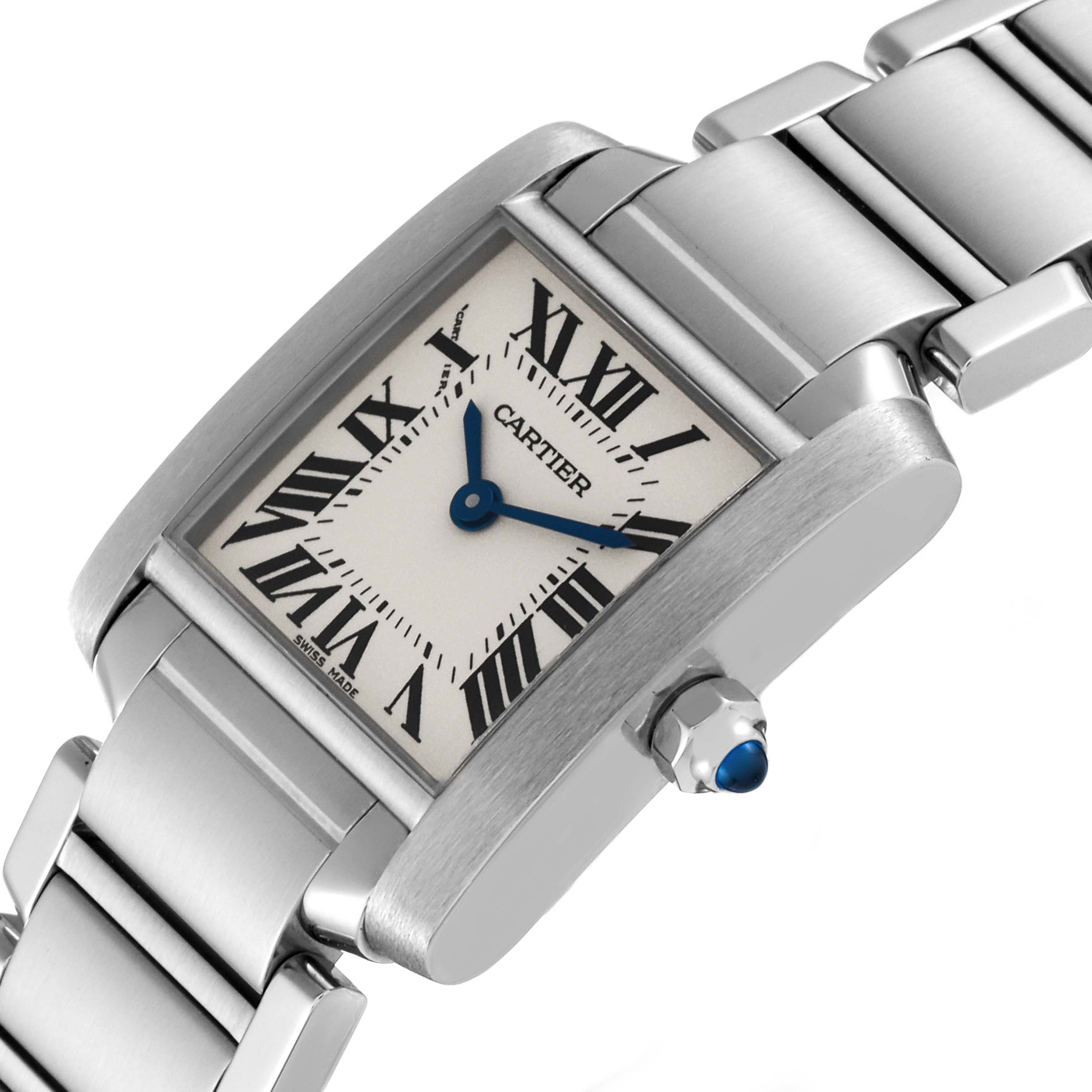 The image shows a Tank Francaise by Cartier, angled to highlight the watch face, crown with a blue gem, and metal bracelet.