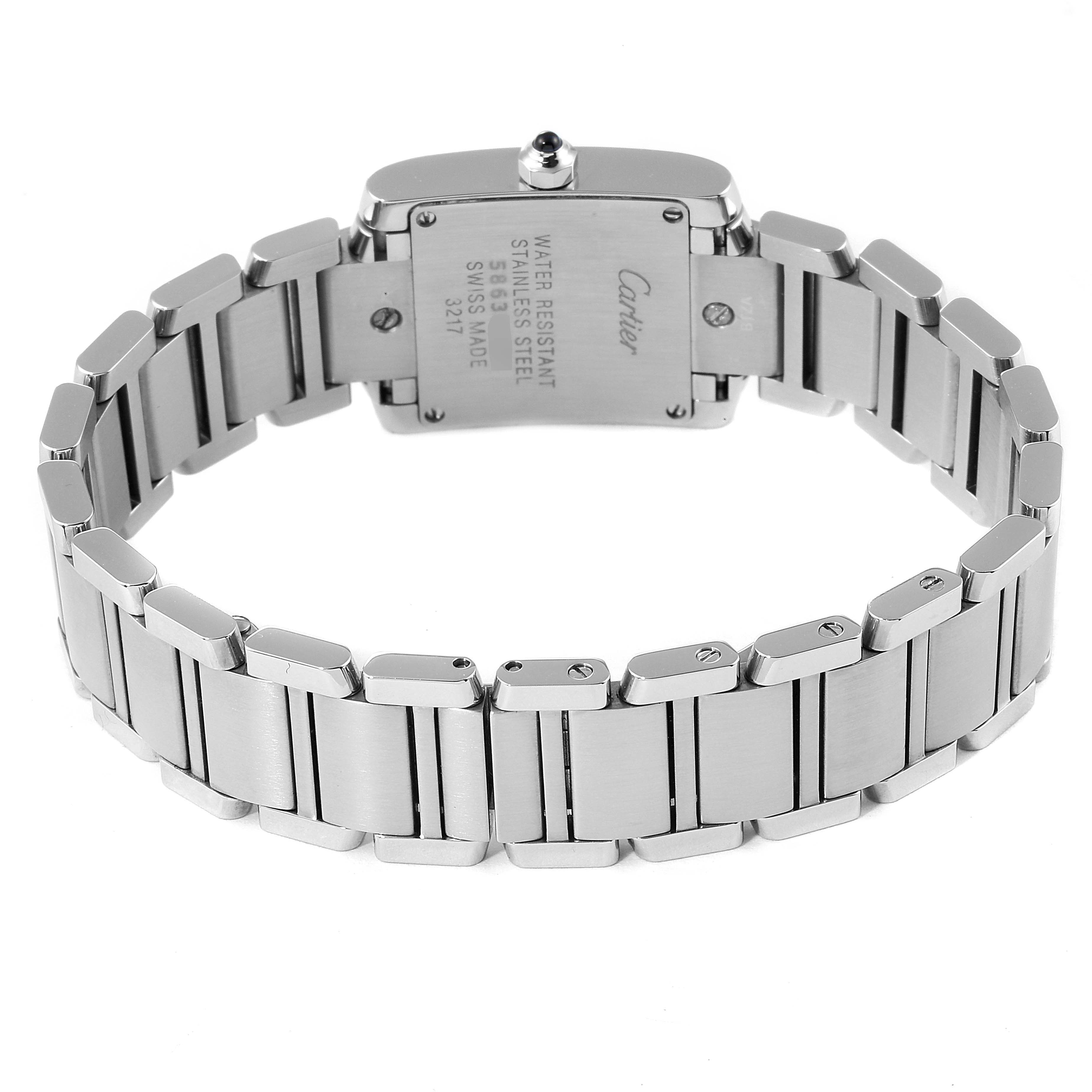 The image shows the back view of the Cartier Tank Française watch, highlighting its stainless steel bracelet and case back.