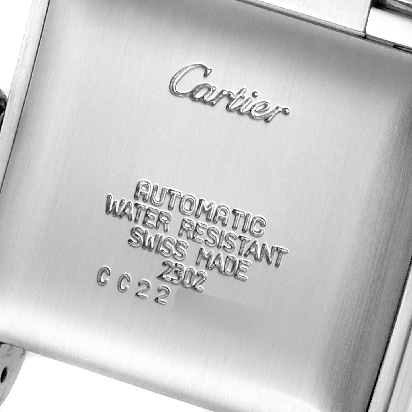 This image shows the back case of a Cartier Tank Française watch, displaying its engraved details.