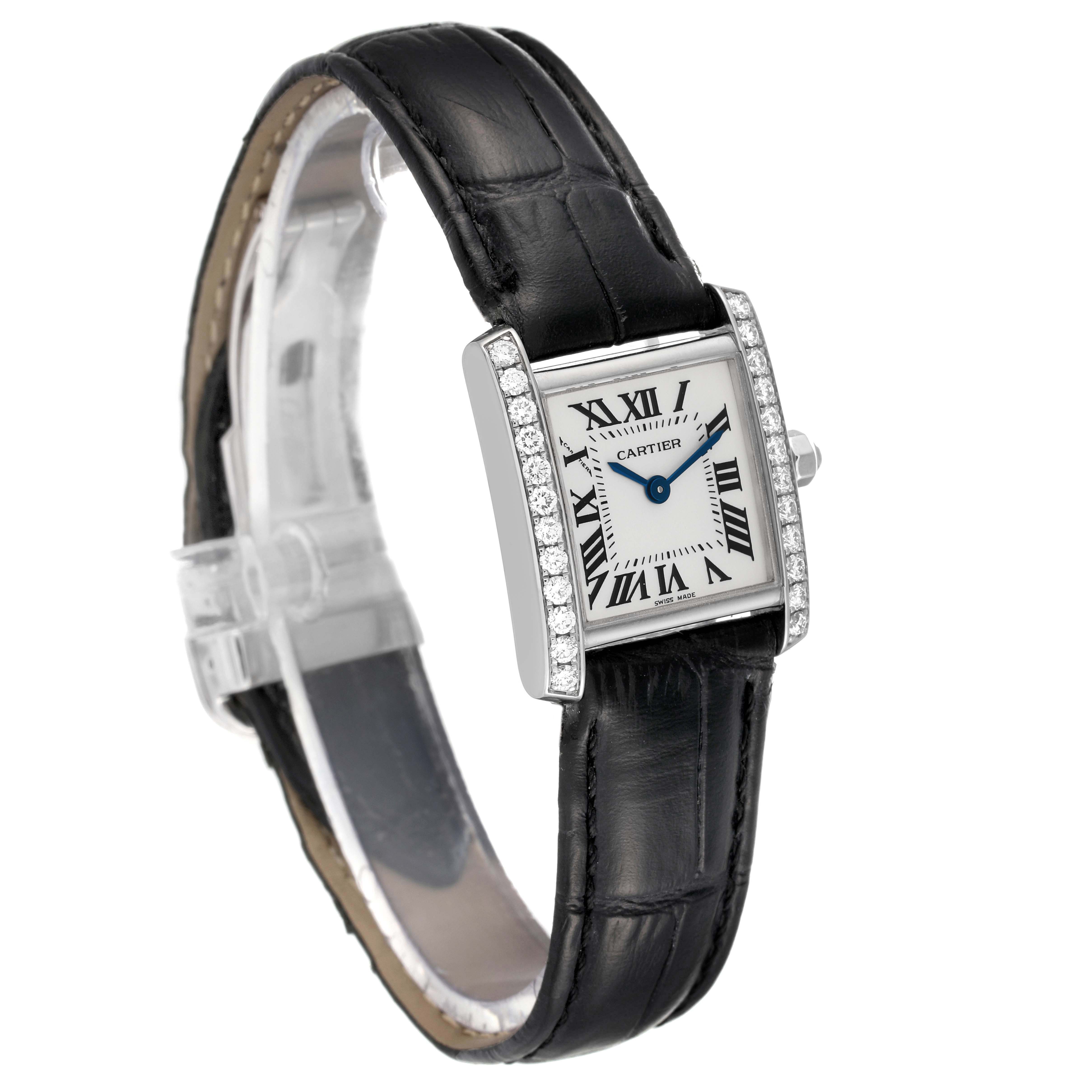 The Cartier Tank Francaise WE100251 Women
s White Gold Silver Dial WE100251 Women
s White Gold Silver Dial watch is shown at an angle highlighting the diamond-encrusted case, face, and black leather strap.