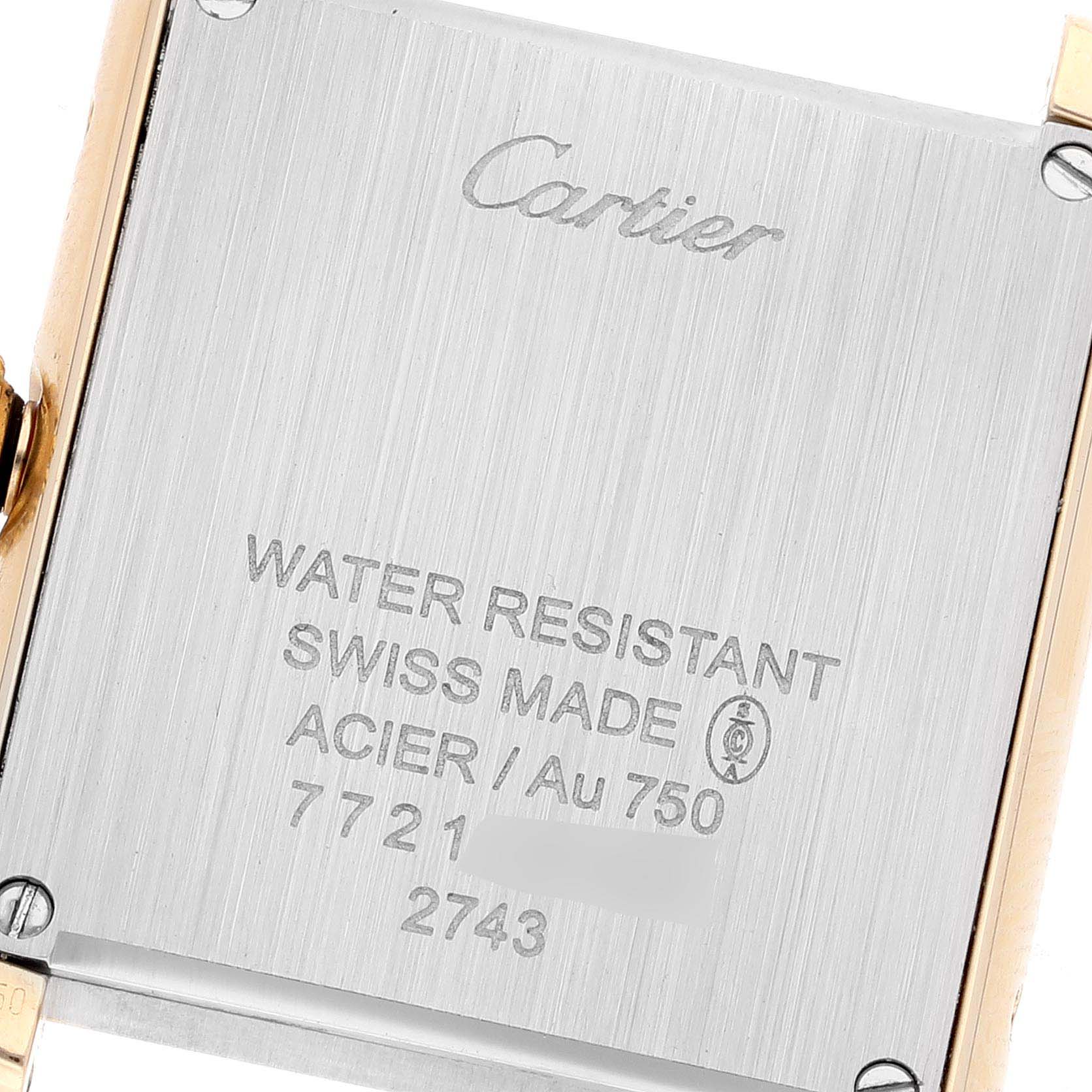 This image shows the back case of the Cartier Tank Solo W1018755 Women's Yellow Gold Silver Dial W1018755 Women's Yellow Gold Silver Dial watch, highlighting its inscriptions and metal components.