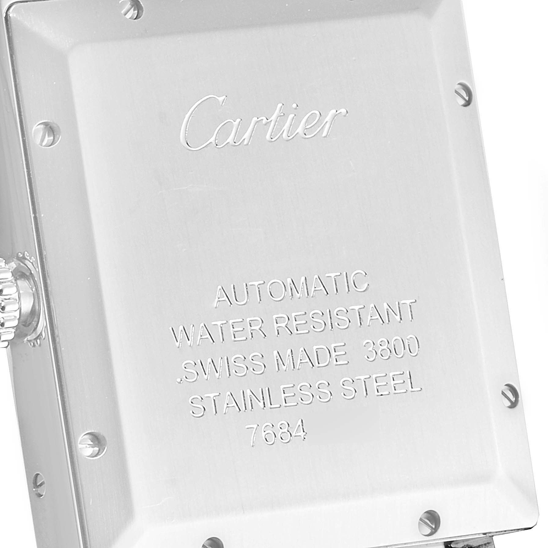 The image shows the case back of a Cartier Tank Solo W5200028 Men's Stainless Steel Silver Dial W5200028 Men's Stainless Steel Silver Dial watch, highlighting the engravings and a portion of the crown.