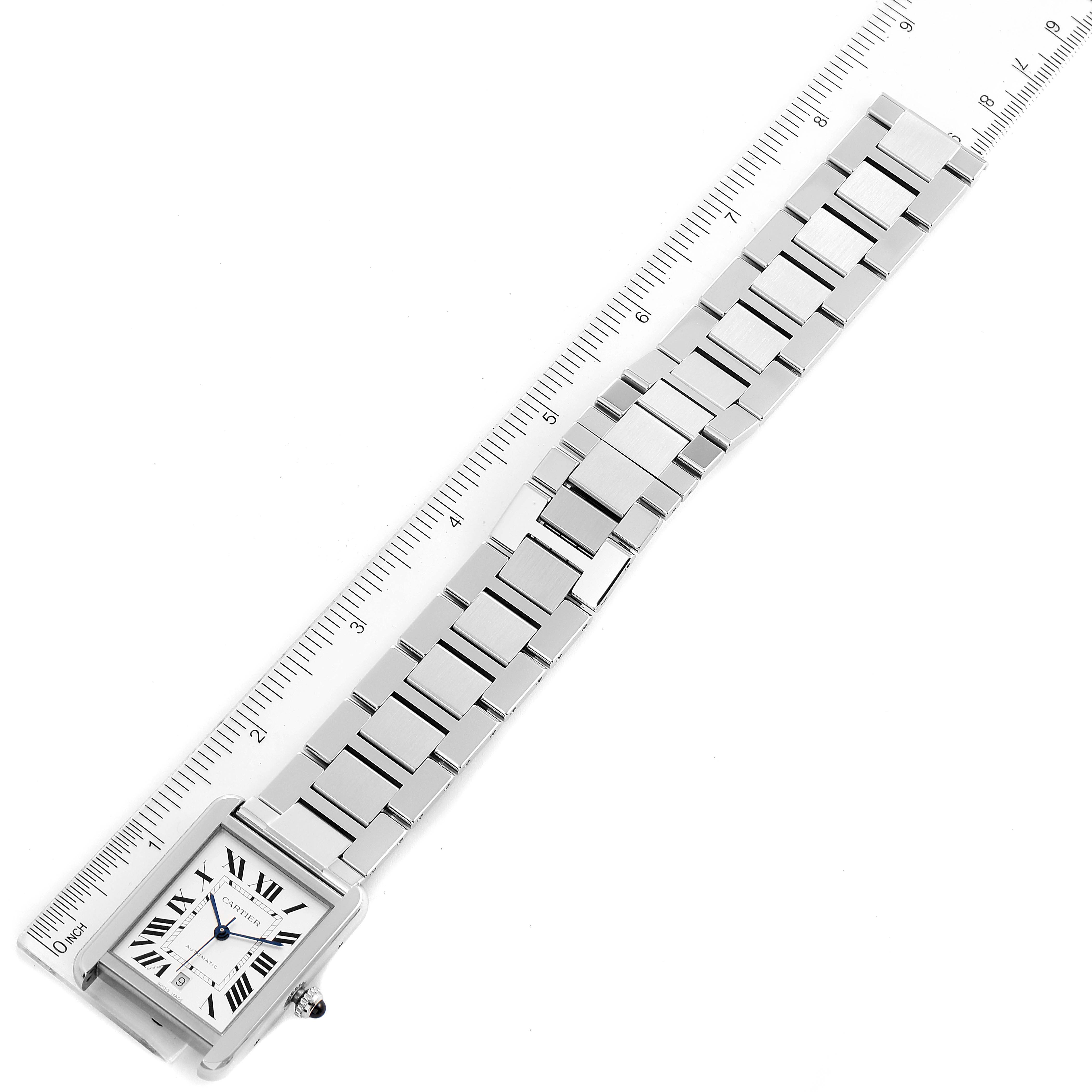 The image shows the Cartier Tank Solo W5200028 Men's Stainless Steel Silver Dial W5200028 Men's Stainless Steel Silver Dial watch laid flat with a ruler adjacent to its metal bracelet.