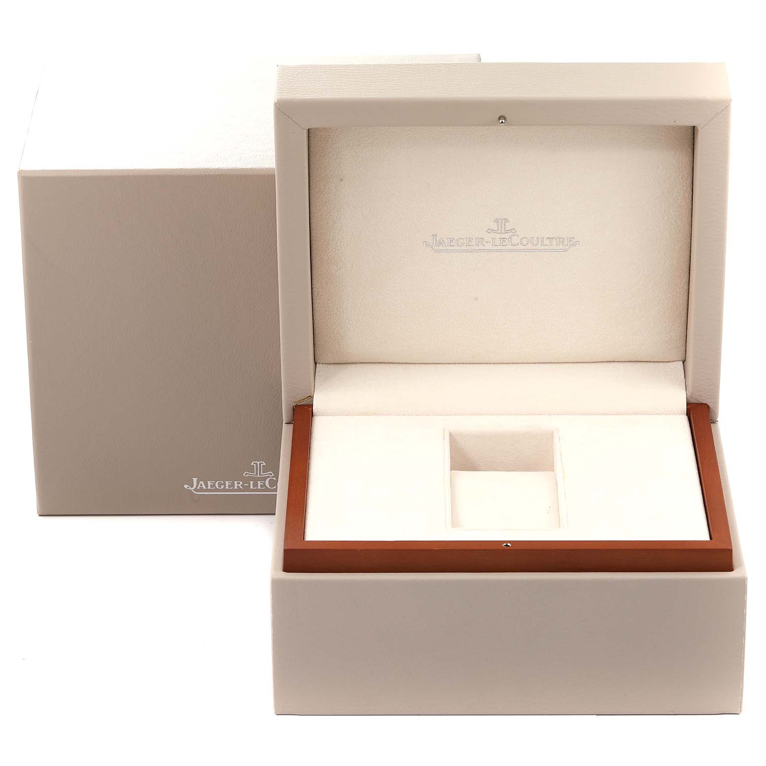 The image shows an open Jaeger-LeCoultre Reverso watch box, displaying its interior.