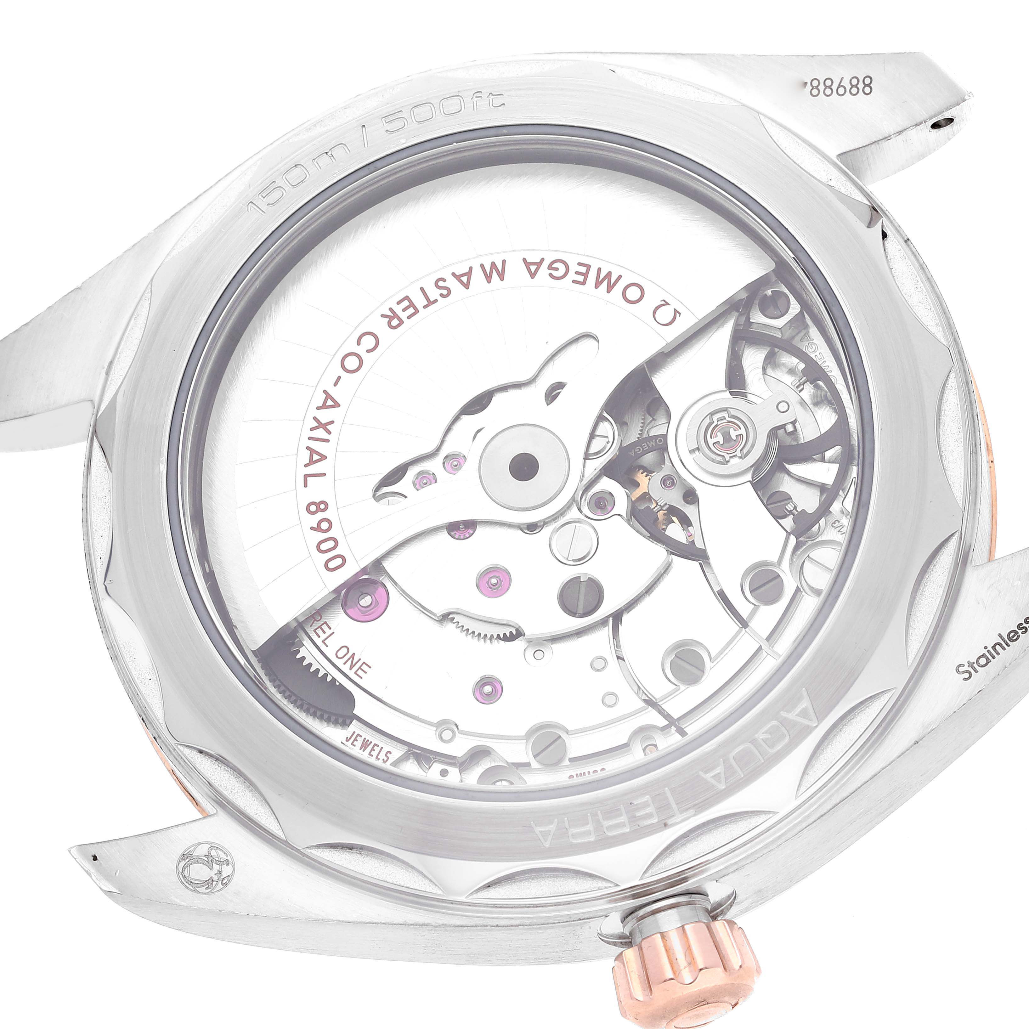 The image shows the back view of an Omega Aqua Terra 220.23.41.21.02.001 Men's Steel and Gold (two tone) Silver Dial 220.23.41.21.02.001 Men's Steel and Gold (two tone) Silver Dial watch, revealing the exposed Co-Axial 8900 movement.