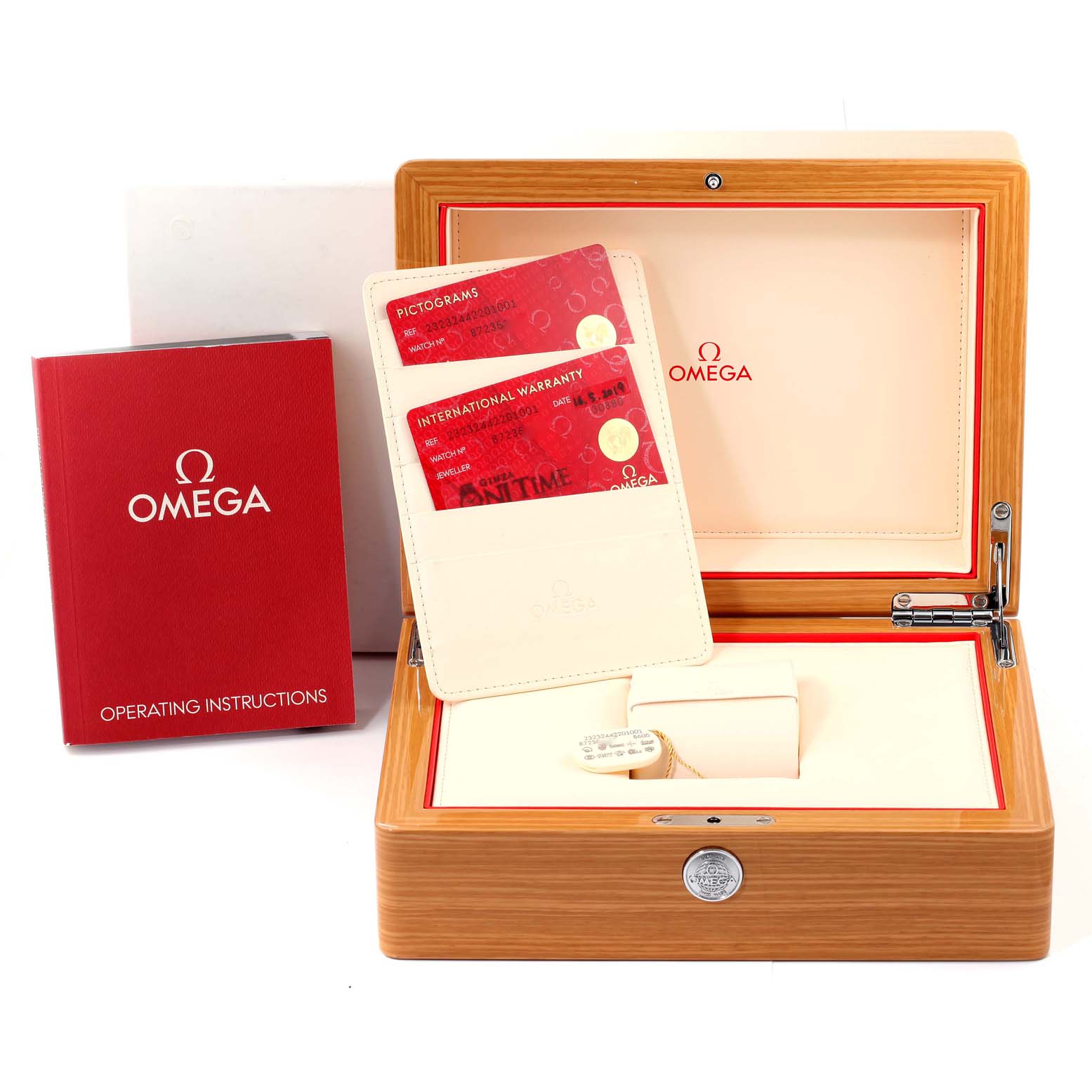 The image shows an Omega Planet Ocean 232.30.44.22.01.001 Men's Stainless Steel Black Dial 232.30.44.22.01.001 Men's Stainless Steel Black Dial watch accessories kit with a wooden box, warranty cards, and an operating instructions booklet.