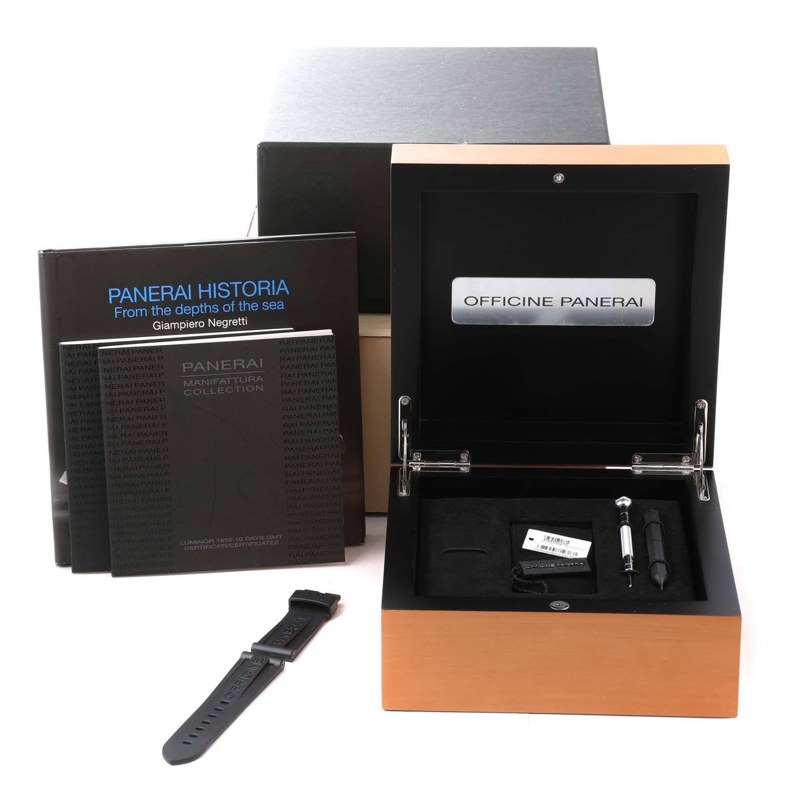 The image shows the open box for a Panerai Luminor PAM00270 Men's Stainless Steel Black Dial PAM00270 Men's Stainless Steel Black Dial watch, along with a strap, books, and watch tools.