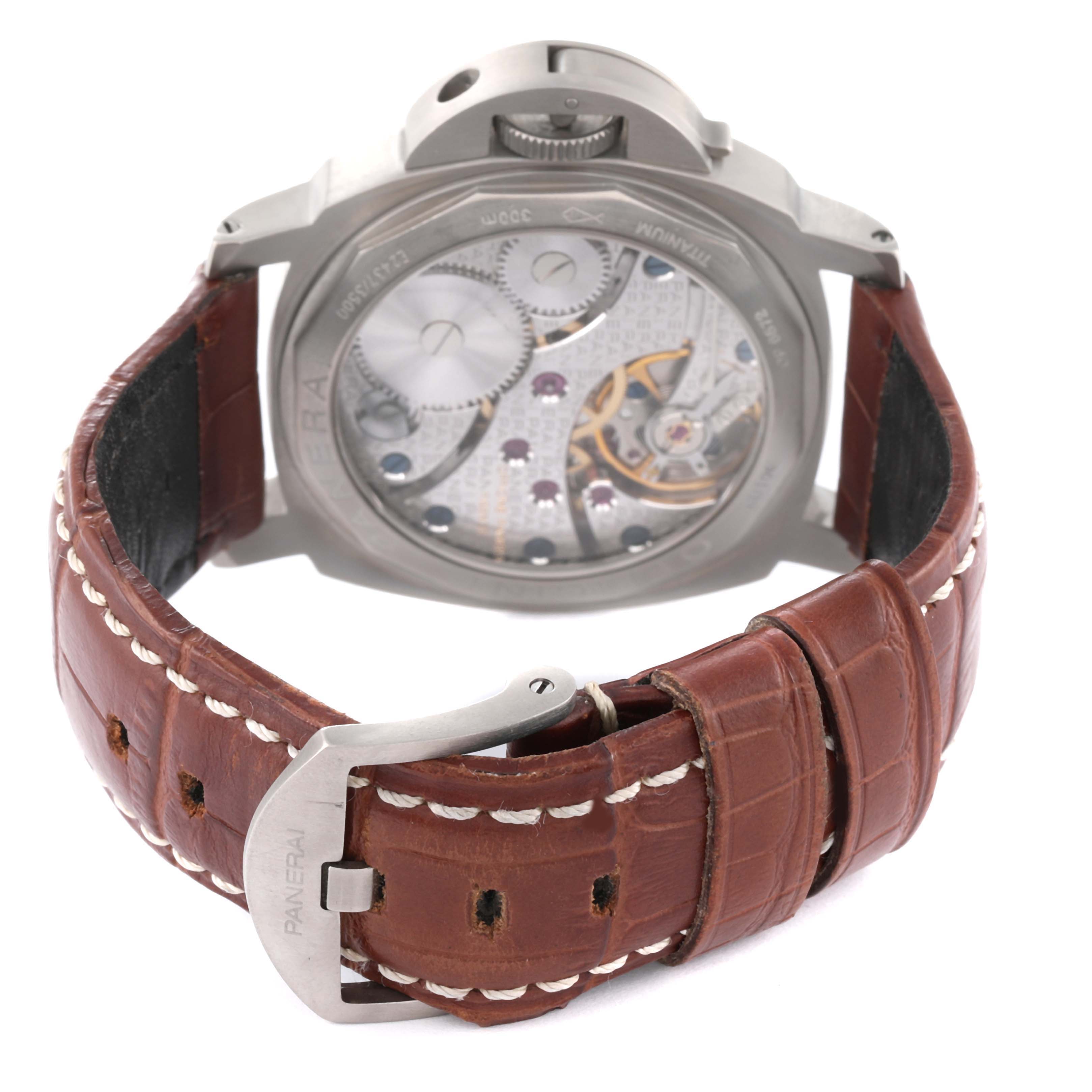 The photo shows the back view of a Panerai Luminor PAM00118 Men's Titanium Brown Dial PAM00118 Men's Titanium Brown Dial watch displaying its movement and brown leather strap with a buckle.