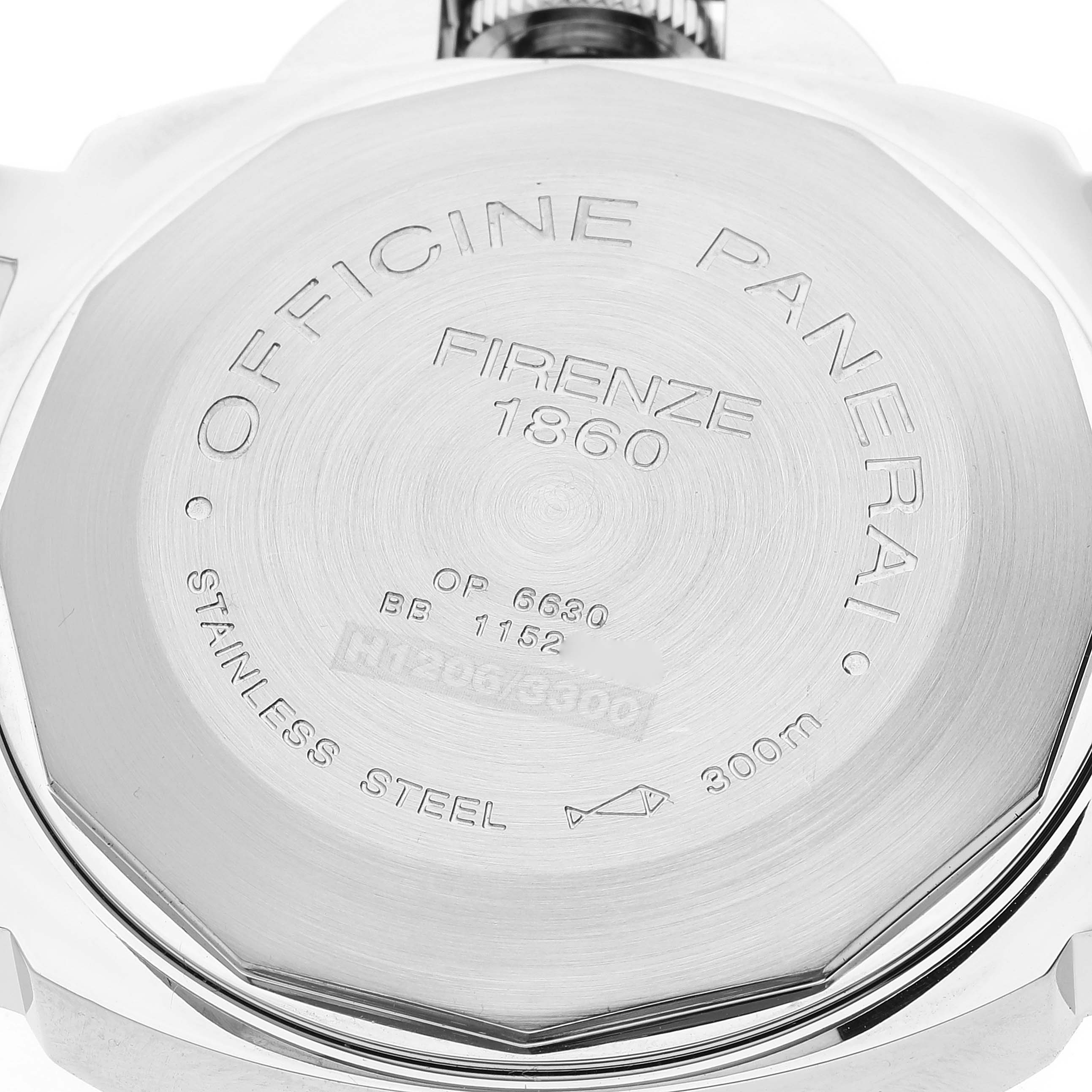 The image shows the engraved backside of a Panerai Luminor PAM00104 Men
s Stainless Steel Black Dial PAM00104 Men
s Stainless Steel Black Dial watch, detailing specifications and origin.