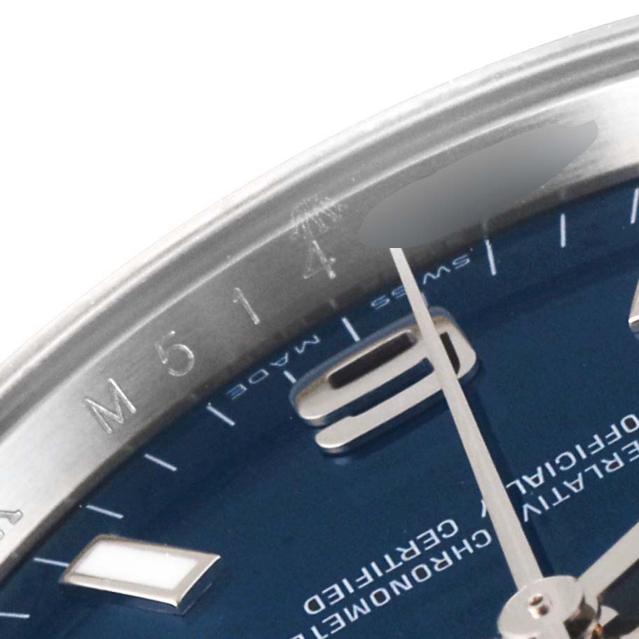 This close-up image shows the dial and part of the bezel of a Rolex Air-King 114200 Men's Stainless Steel Blue Dial 114200 Men's Stainless Steel Blue Dial watch, focusing on the hour markers and hands.