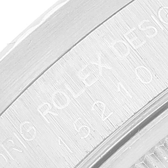 The close-up image shows the engraved side of the caseback of a Rolex Date 15210 Men
s Stainless Steel Silver Dial 15210 Men
s Stainless Steel Silver Dial model watch.