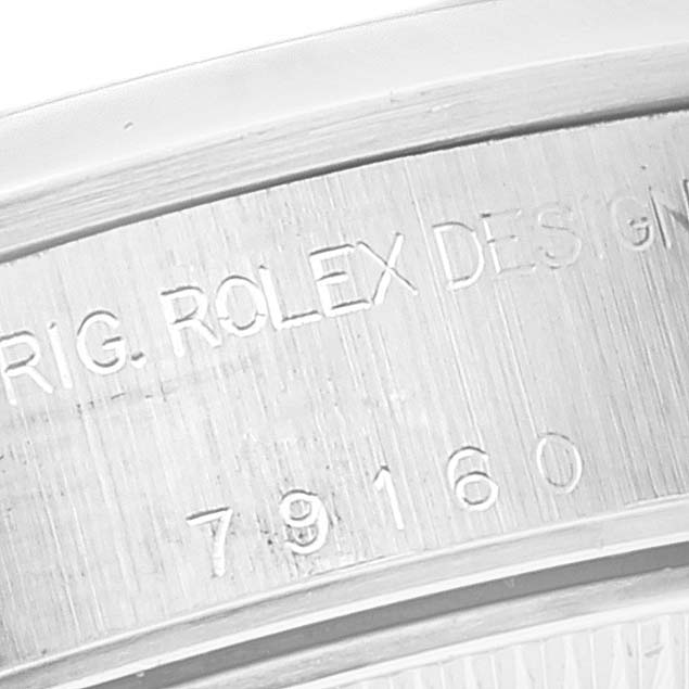 The image shows a close-up of the model and serial number engraving on the side of a Rolex Date 79160 Women's Stainless Steel Silver Dial 79160 Women's Stainless Steel Silver Dial watch.