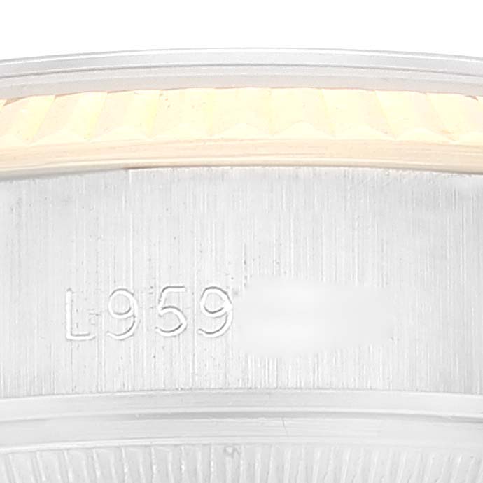 This close-up angle shows the engraved serial number on the case side of a Rolex Datejust 69173 Women's Steel and Gold (two tone) Champagne Dial 69173 Women's Steel and Gold (two tone) Champagne Dial watch.