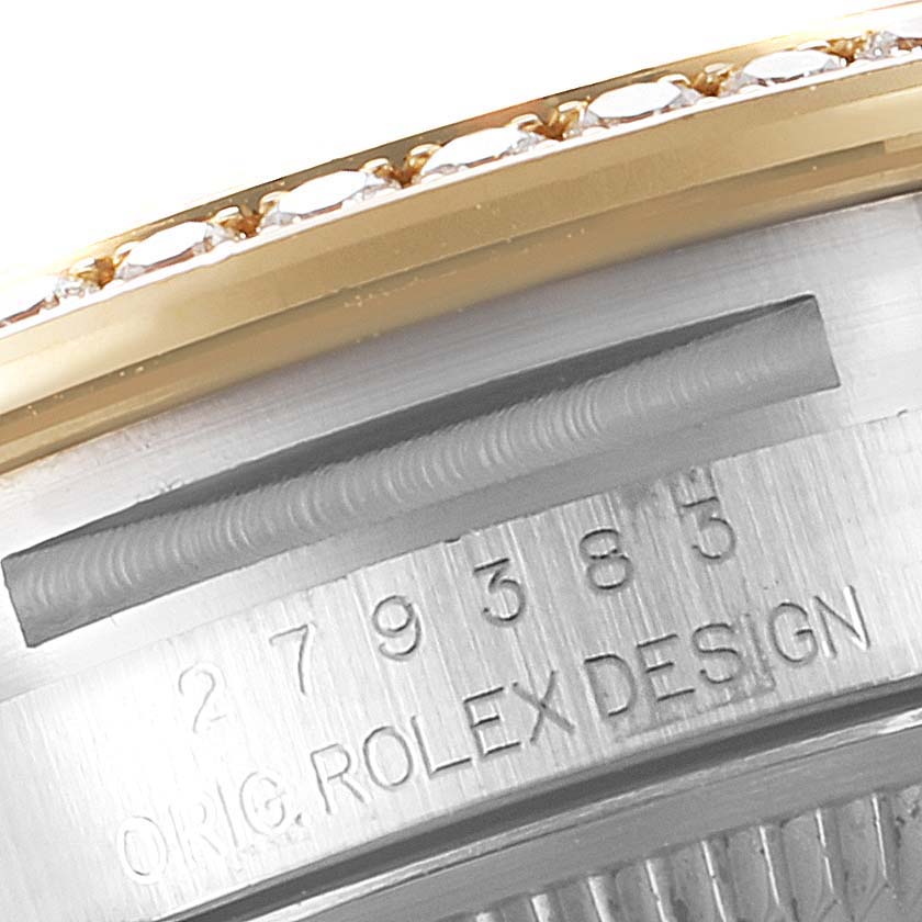 The image shows a close-up of the serial number and bezel of a Rolex Datejust 279383 Women
s Steel and Gold (two tone) Silver Dial 279383 Women
s Steel and Gold (two tone) Silver Dial watch.