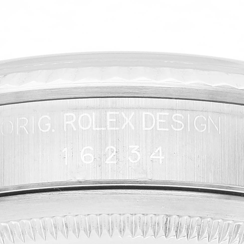 This image shows a close-up angle of the side of a Rolex Datejust 16234 Men's Stainless Steel Silver Dial 16234 Men's Stainless Steel Silver Dial watch, highlighting "ROLEX DESIGN" and the reference number "16234."