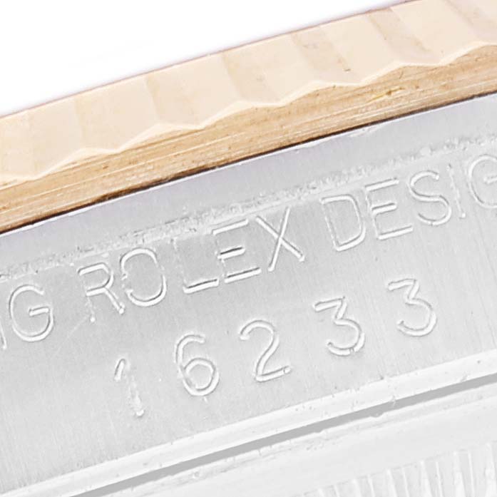 The image shows a close-up of the case side and part of the fluted bezel of a Rolex Datejust 16233 Men's Steel and Gold (two tone) Blue Dial 16233 Men's Steel and Gold (two tone) Blue Dial watch, revealing the model number 16233.