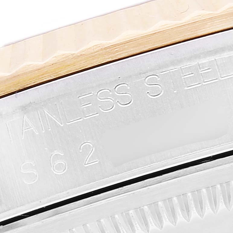 The image shows a close-up view of the side of a Rolex Datejust 16233 Men's Steel and Gold (two tone) Black Dial 16233 Men's Steel and Gold (two tone) Black Dial watch and part of its stainless steel bezel.