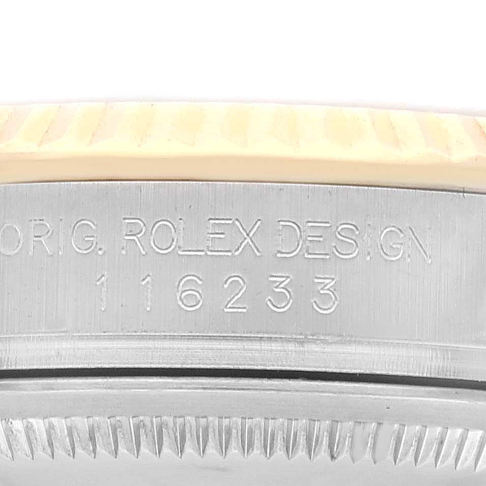 The image shows a close-up of the side of a Rolex Datejust 116233 Men's Steel and Gold (two tone) Champagne Dial 116233 Men's Steel and Gold (two tone) Champagne Dial model, highlighting the model number and engraved text.
