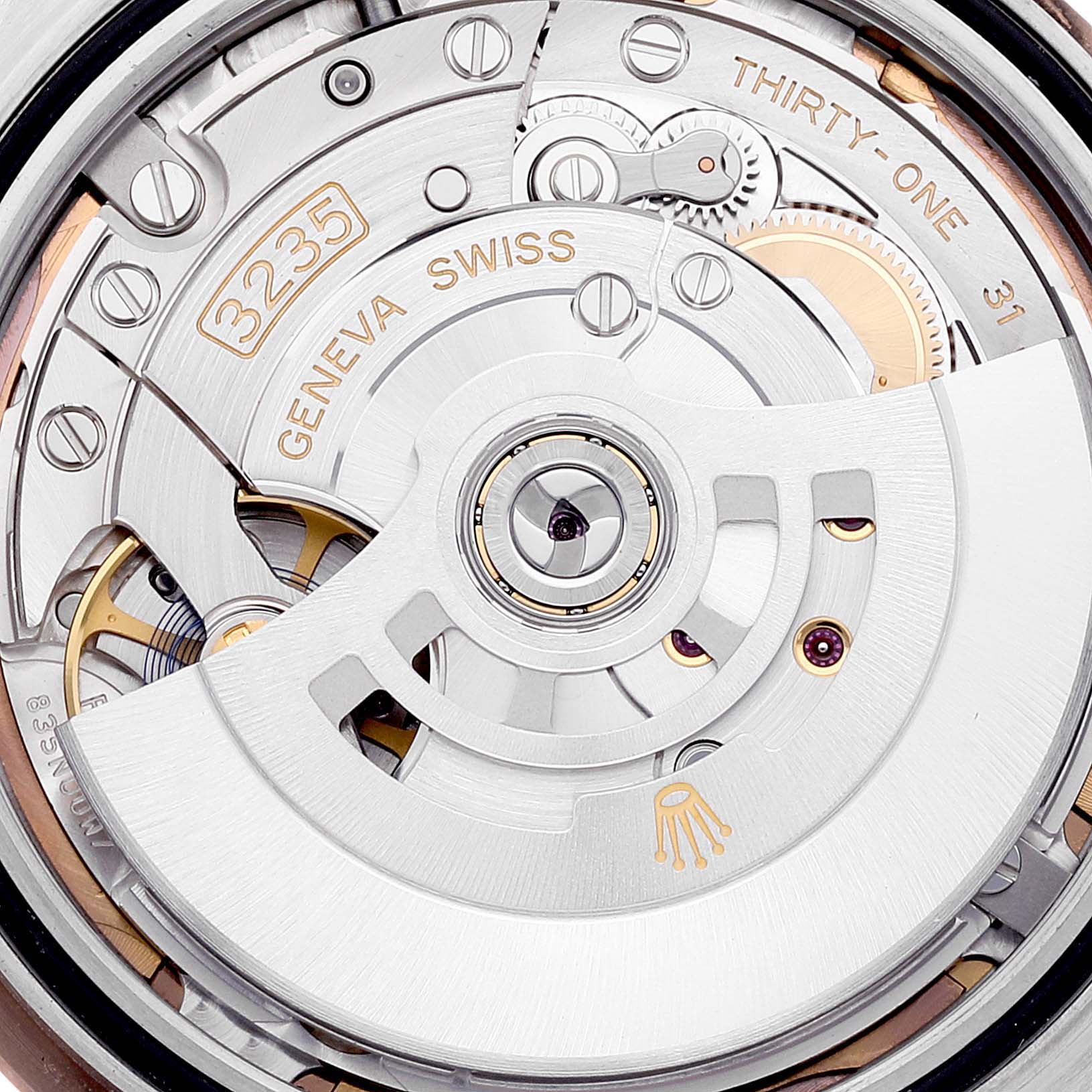 This image shows a detailed view of the movement mechanism of a Rolex Datejust 41 126331 Men
s Steel and Gold (two tone) Brown Dial 126331 Men
s Steel and Gold (two tone) Brown Dial watch, highlighting its intricate parts.