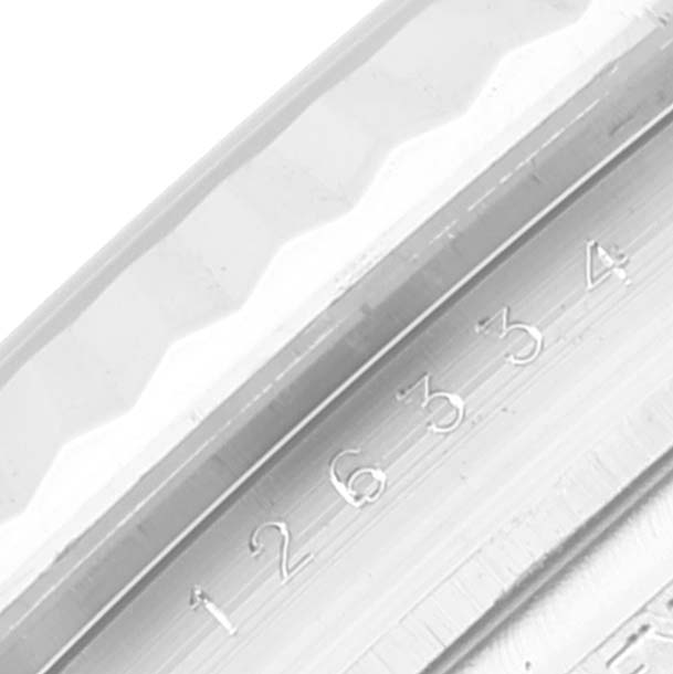 This image shows a close-up of the model and serial number engraving on the inner bezel of a Rolex Datejust 41 126334 Men's Stainless Steel White Dial 126334 Men's Stainless Steel White Dial watch.