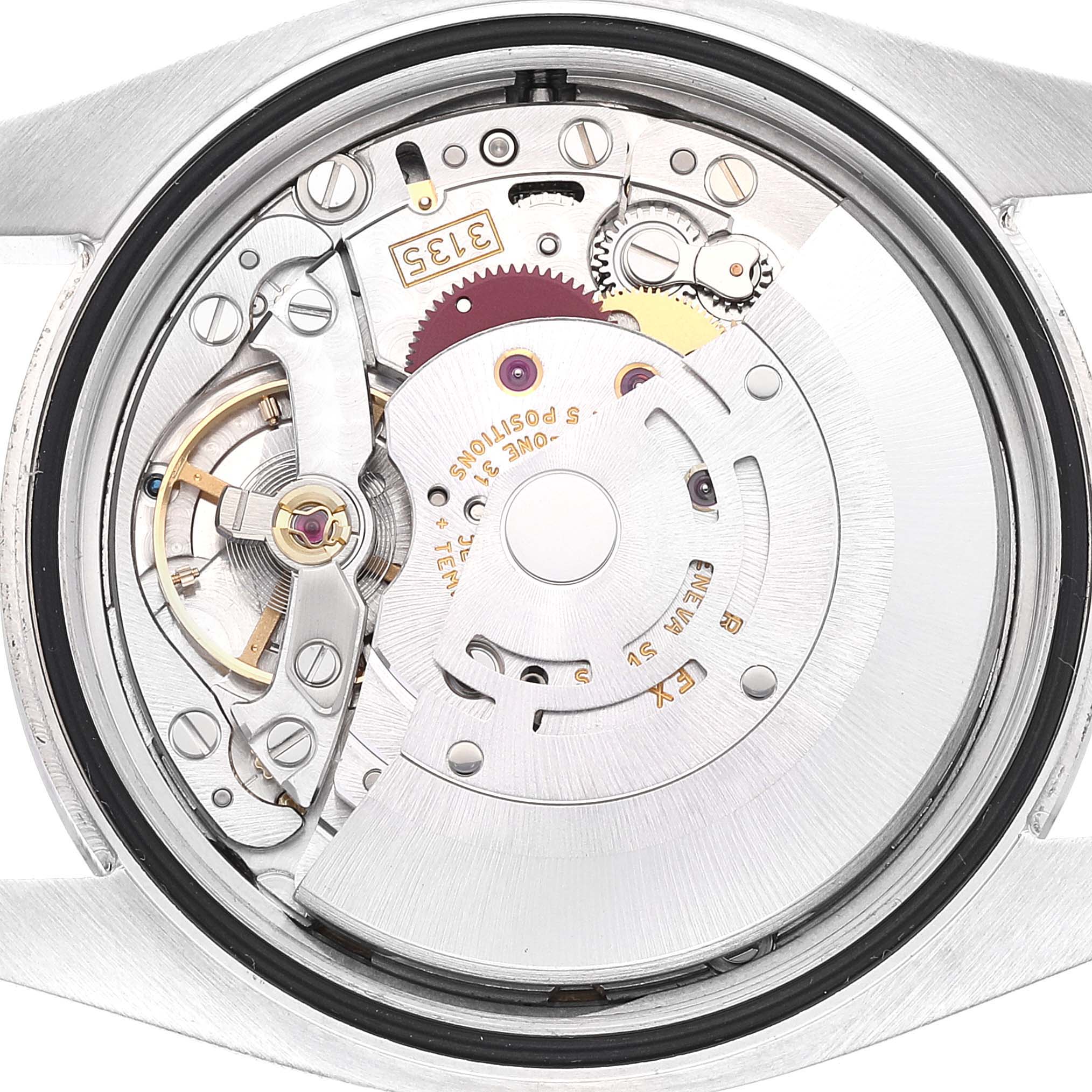 The image shows the intricate inner mechanism and movement parts of a Rolex Datejust 116200 Men's Stainless Steel Blue Dial 116200 Men's Stainless Steel Blue Dial watch, viewed from the back.