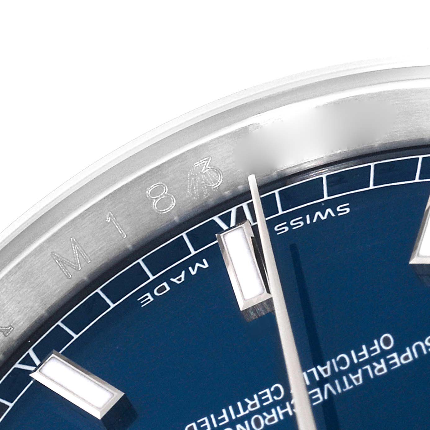 This close-up image of a Rolex Datejust 116200 Men's Stainless Steel Blue Dial 116200 Men's Stainless Steel Blue Dial watch shows the dial, hands, indices, and part of the bezel with reference numbers.