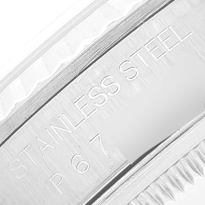 This image shows a close-up of the engraving on the stainless steel bezel of a Rolex Datejust 16234 Men's Stainless Steel Blue Dial 16234 Men's Stainless Steel Blue Dial watch.