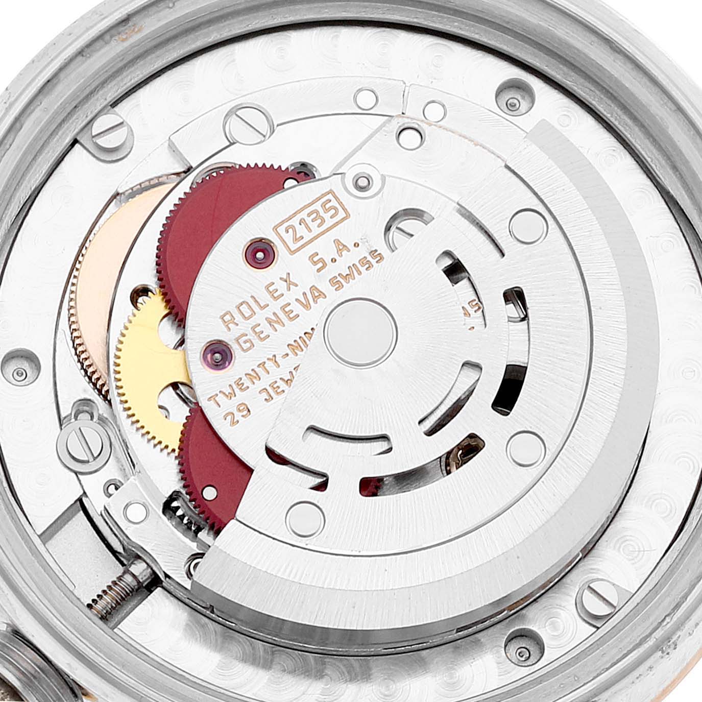This image shows the internal movement mechanism of a Rolex Mid-Size 68273 Women
s Steel and Gold (two tone) Champagne Dial 68273 Women
s Steel and Gold (two tone) Champagne Dial watch, featuring gears and the rotor engraved with "Rolex S.A. Geneva Swiss."