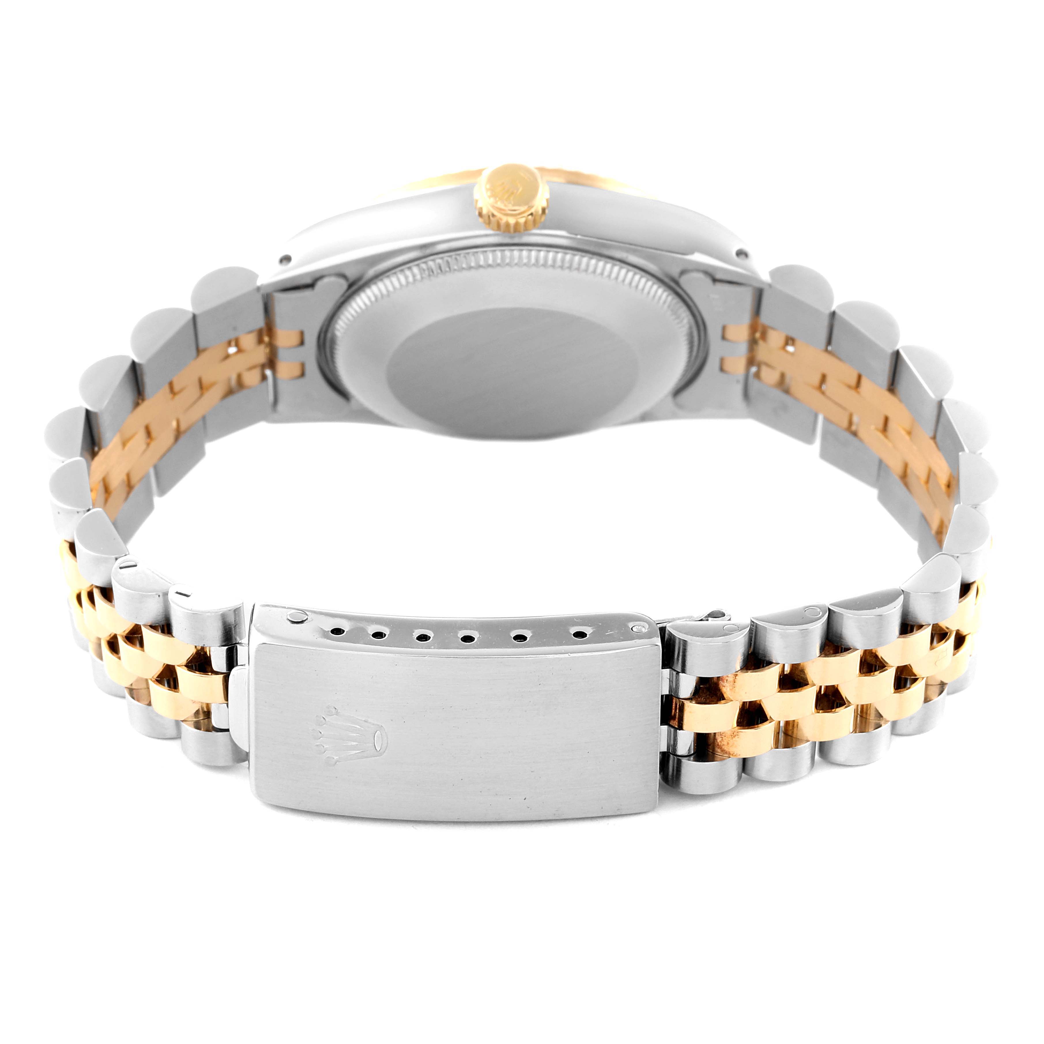 The image shows the back of a Mid-Size Rolex watch, highlighting its case, crown, and two-tone jubilee bracelet with the clasp.
